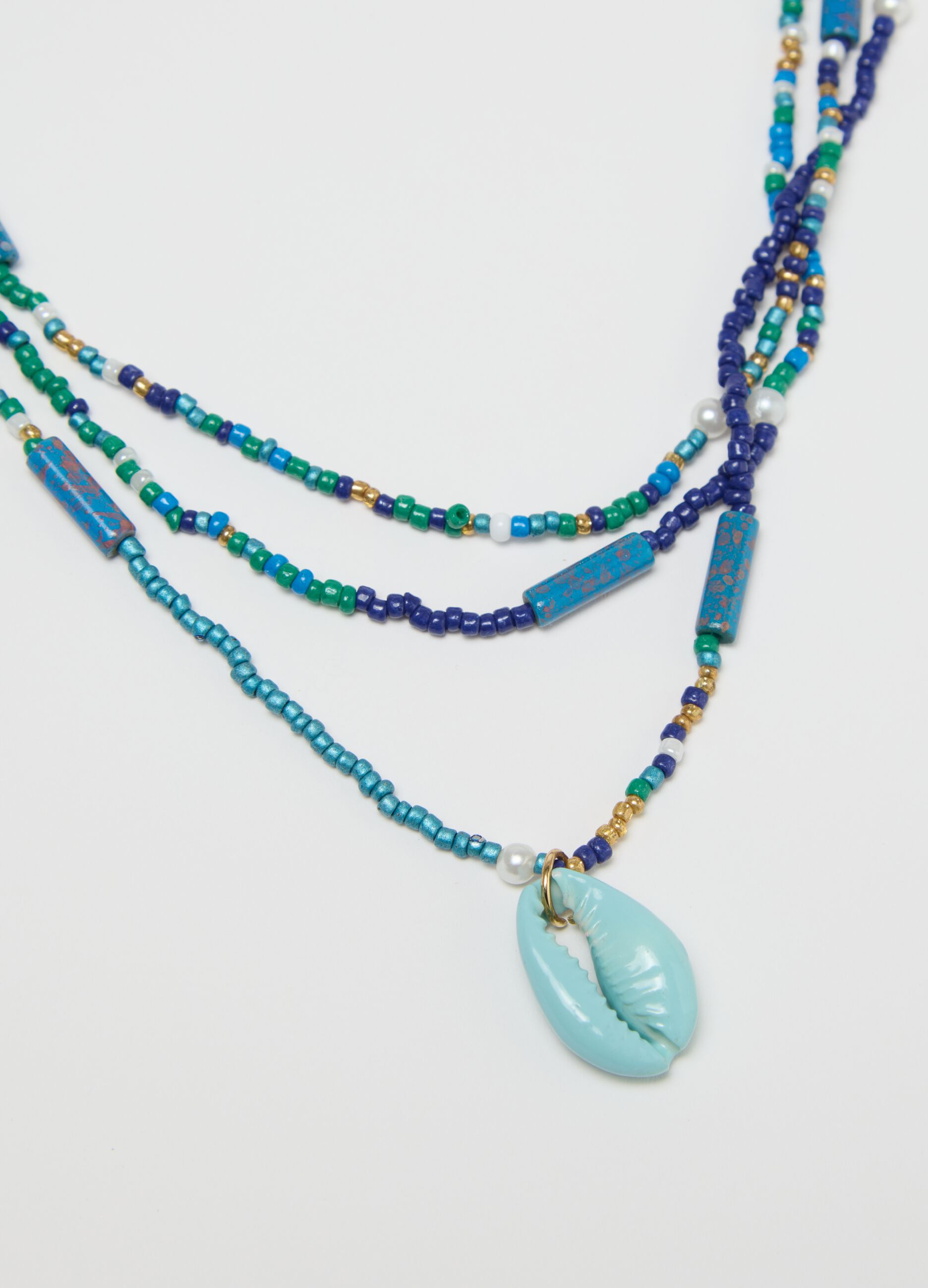 Multi-strand necklace with beads and shell