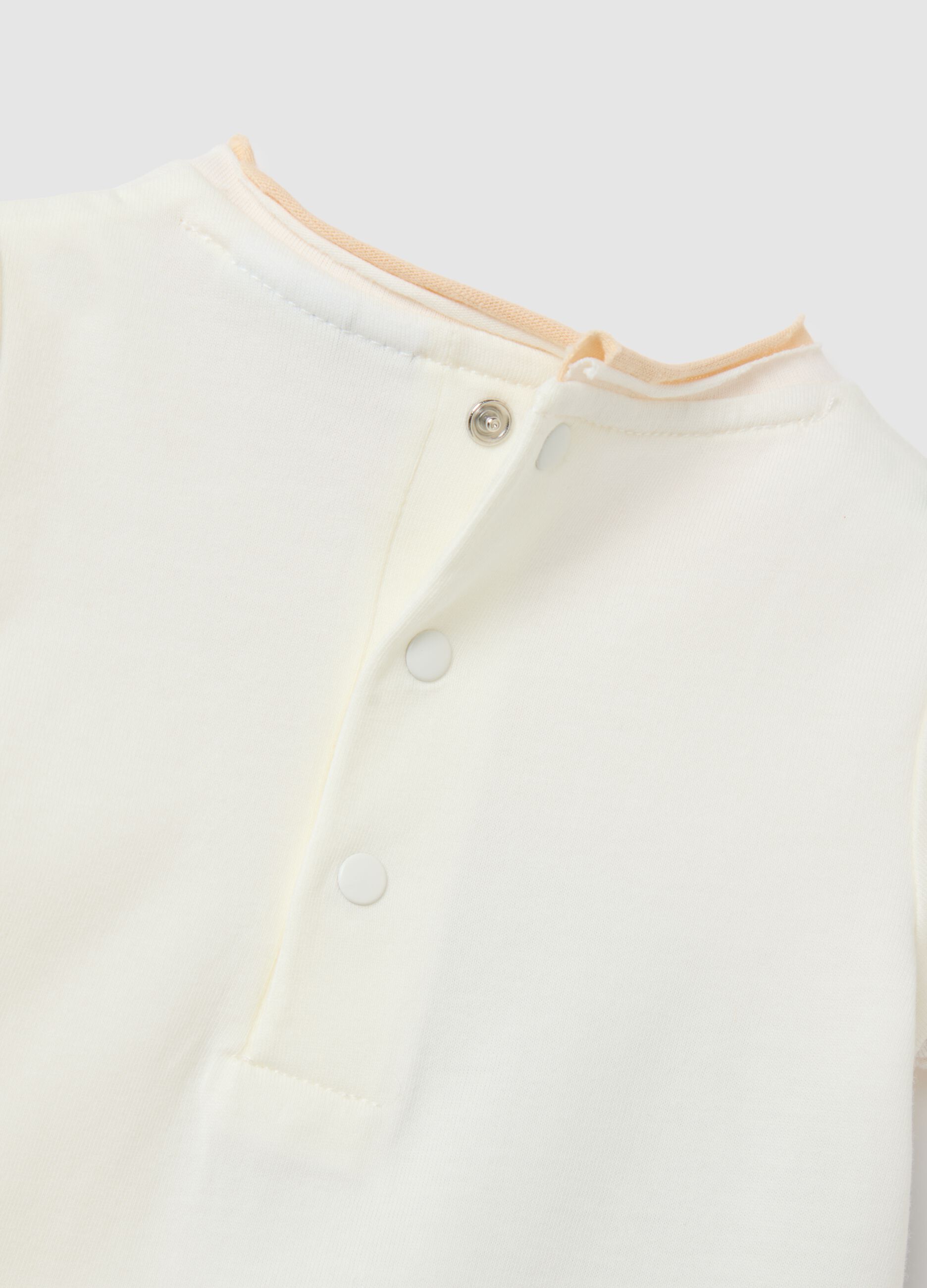 Baby bodysuit in pure white cotton with print