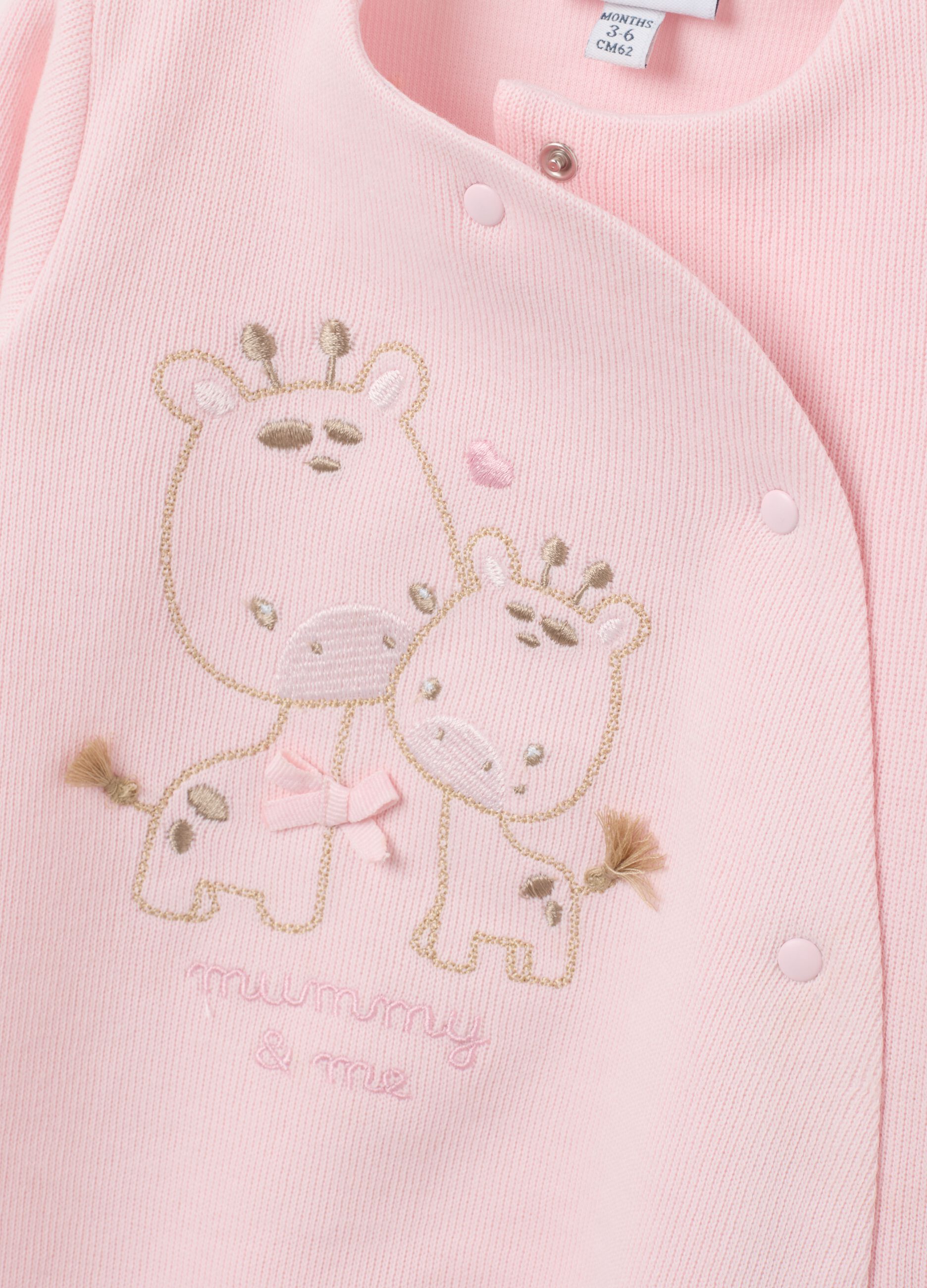 Baby sleepsuit in pure pink cotton with lions