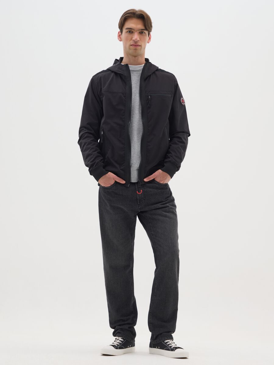 Black jacket in heavy fabric with hood and zip_1