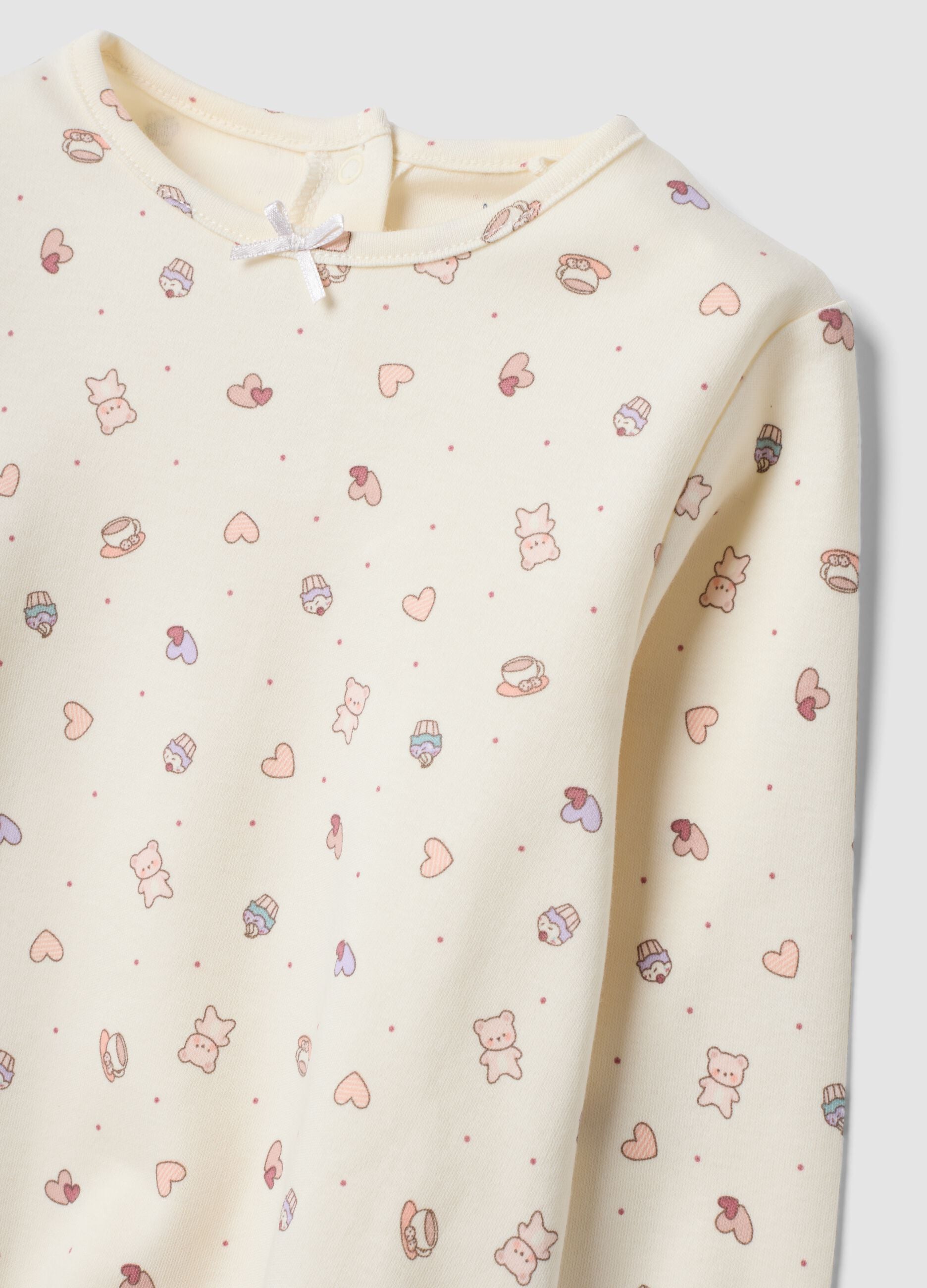 White organic cotton pyjamas with hearts and teddy bear print for baby girl