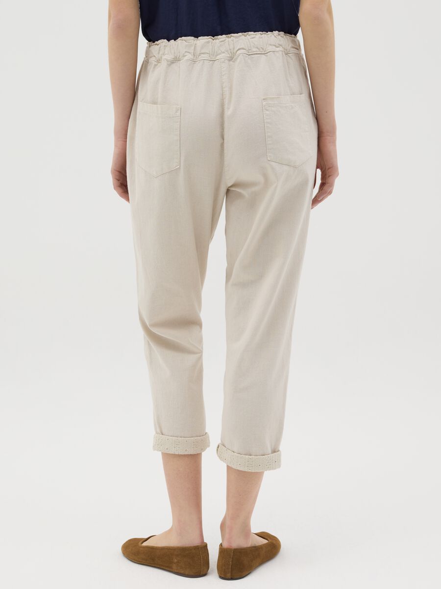 Beige trousers with drawstring and broderie anglaise details_2