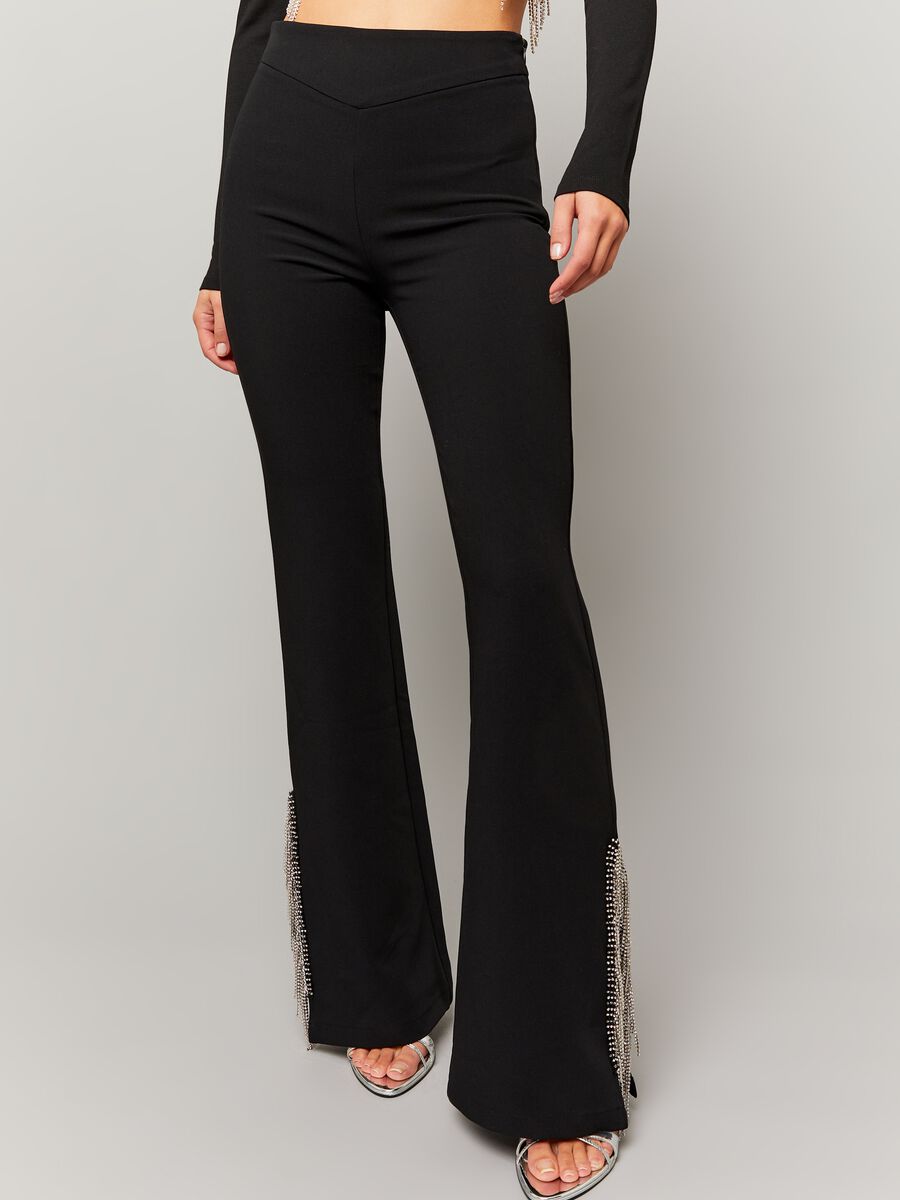 Flare-fit trousers with fringes in diamantés_1