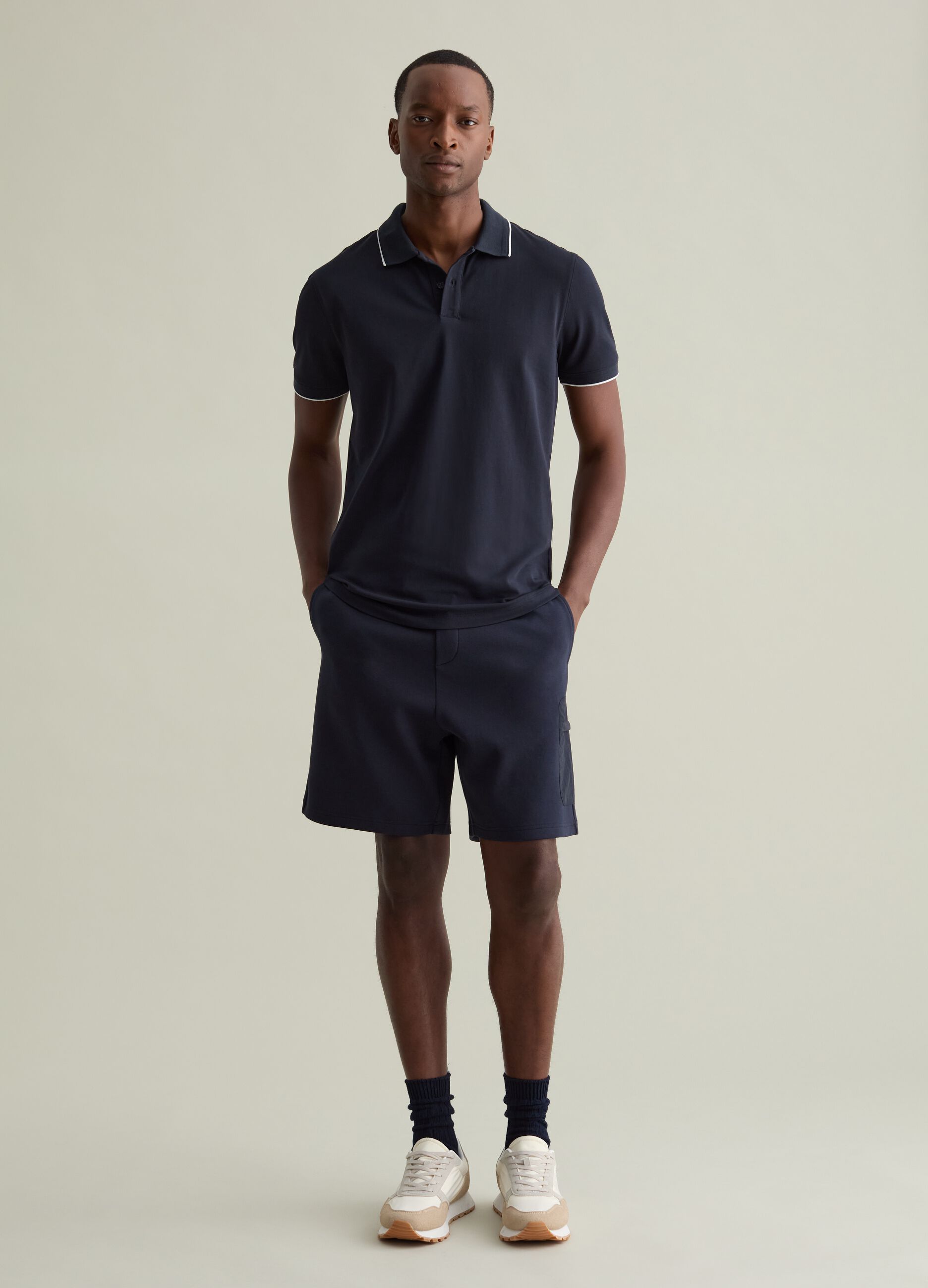 Polo shirt in technical fabric with contrasting edging
