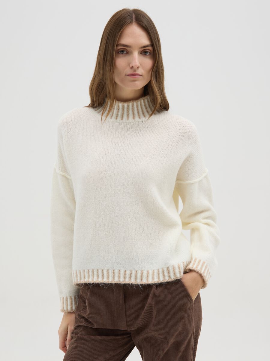 Light beige sweater with high collar and contrasting edges_0