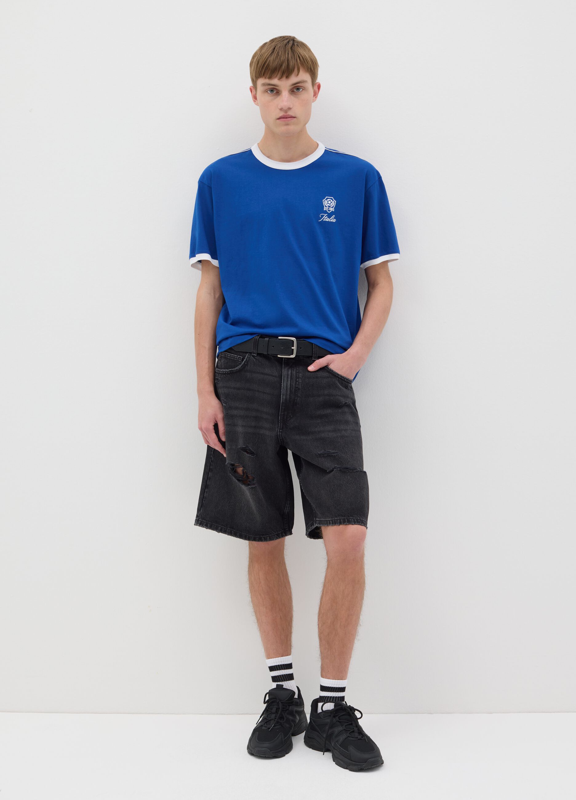 Black denim shorts with ripped details