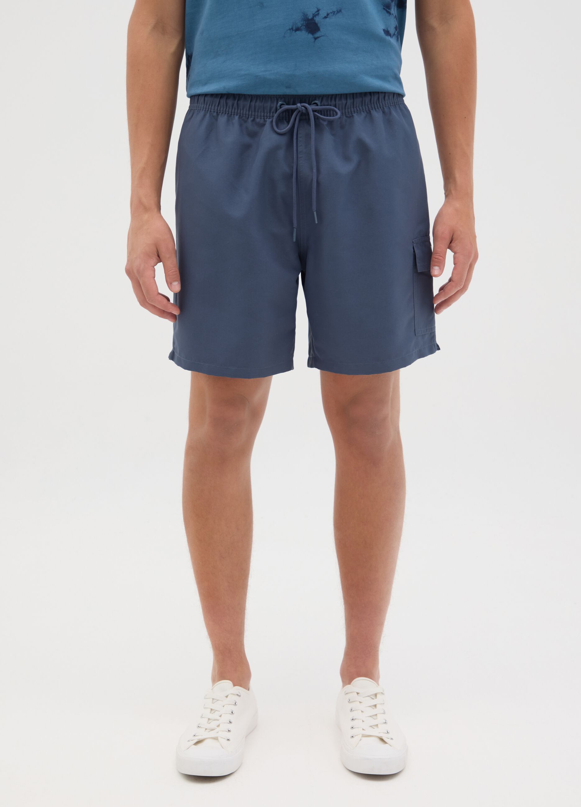 Blue swimming trunks with logo print