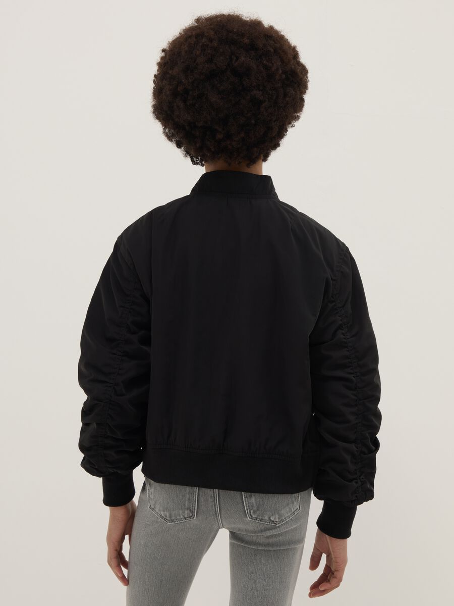 Oversized fit black bomber jacket for girls with pockets_1