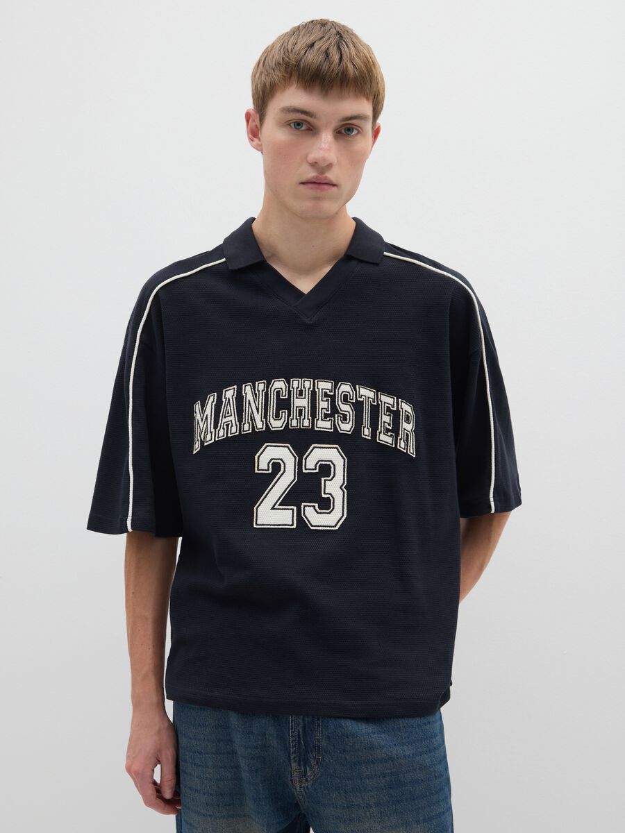 Polo sportiva in puro cotone nero vestibilità oversize_0