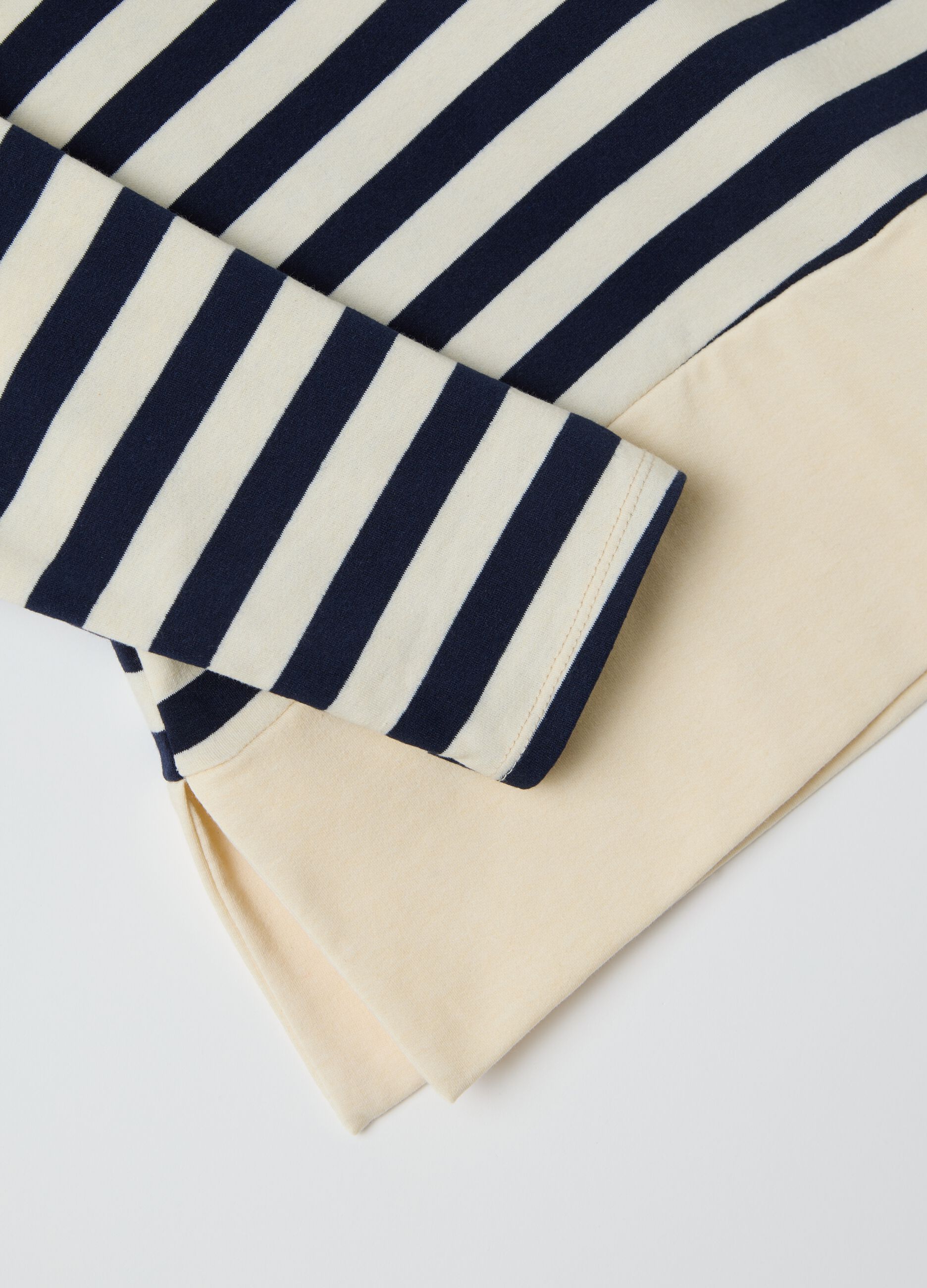 Blue and white striped top with long sleeves