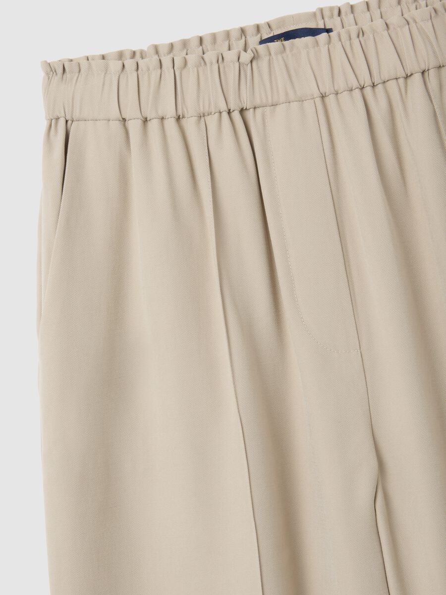 Pantaloni The Iconic Pants beige a gamba larga_5