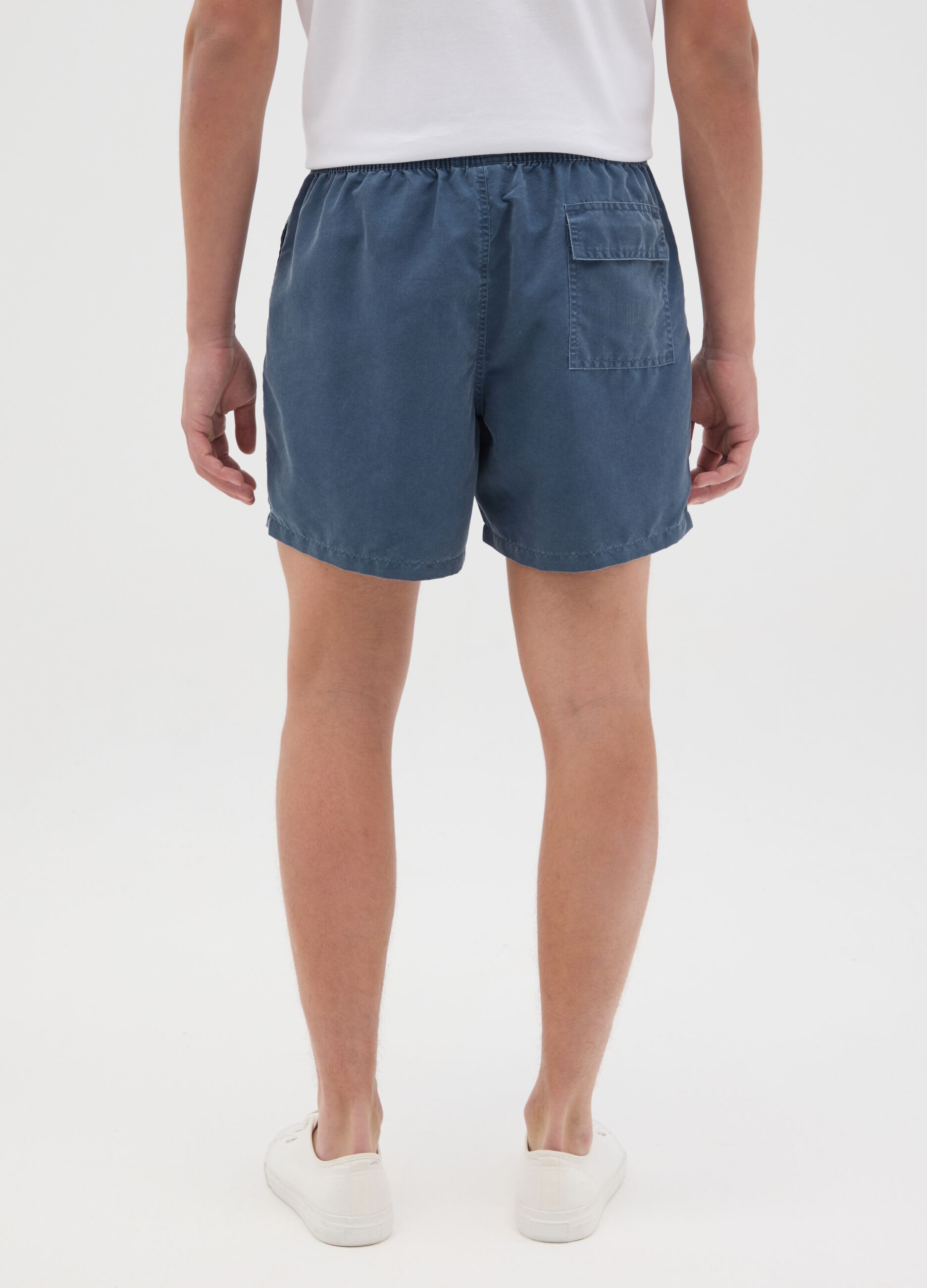 Blue swimming trunks with logo print