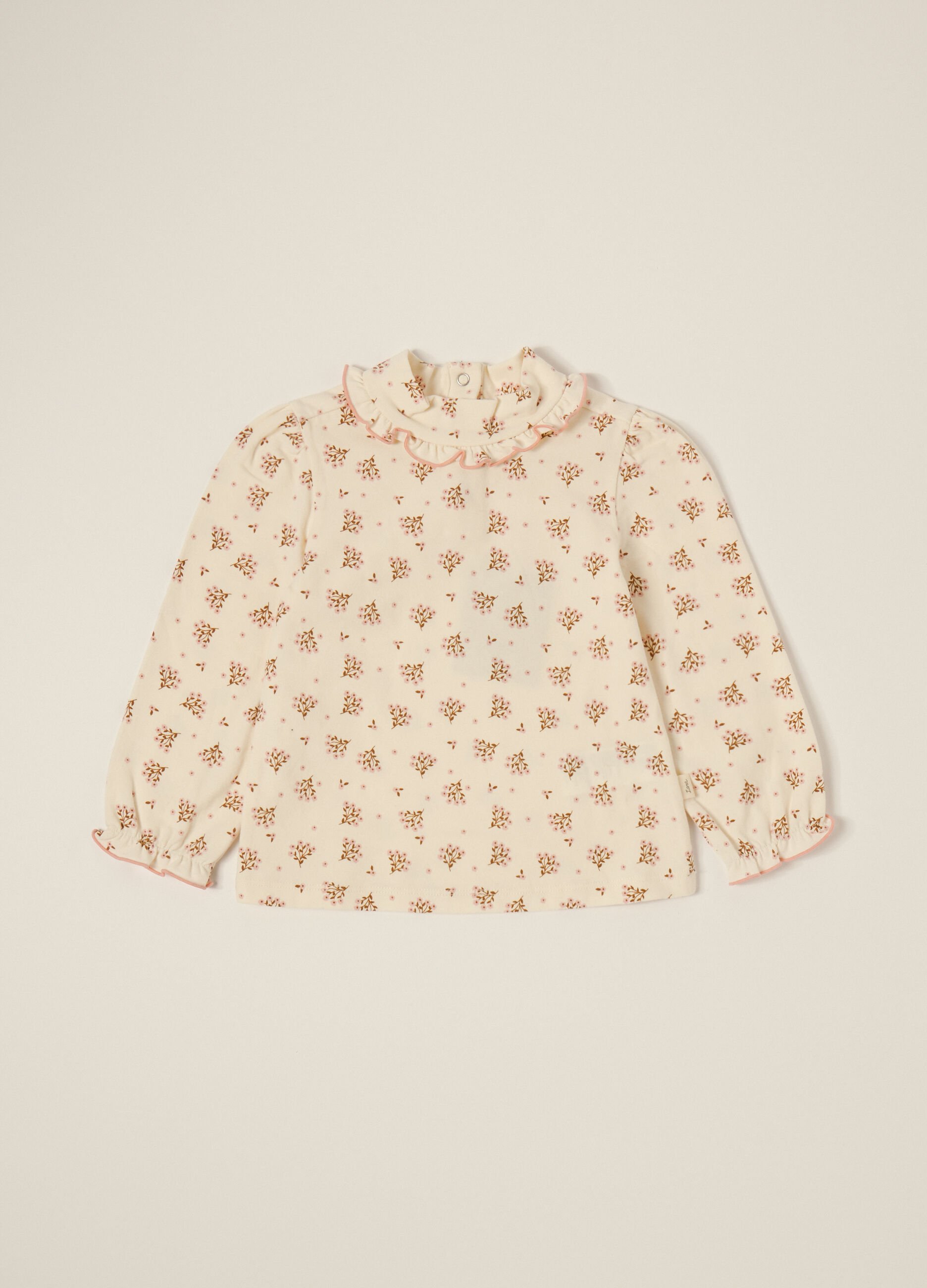 White long-sleeve top with floral print