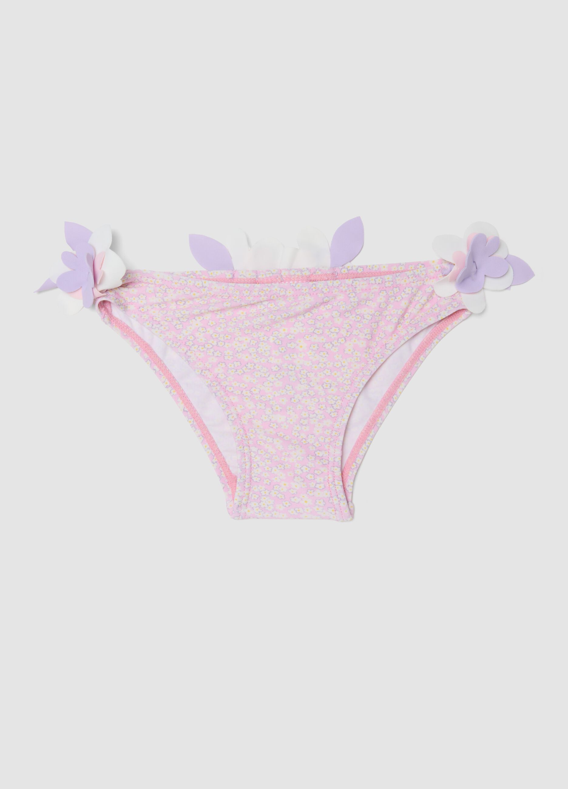 Pink stretch swim briefs with applied floral details