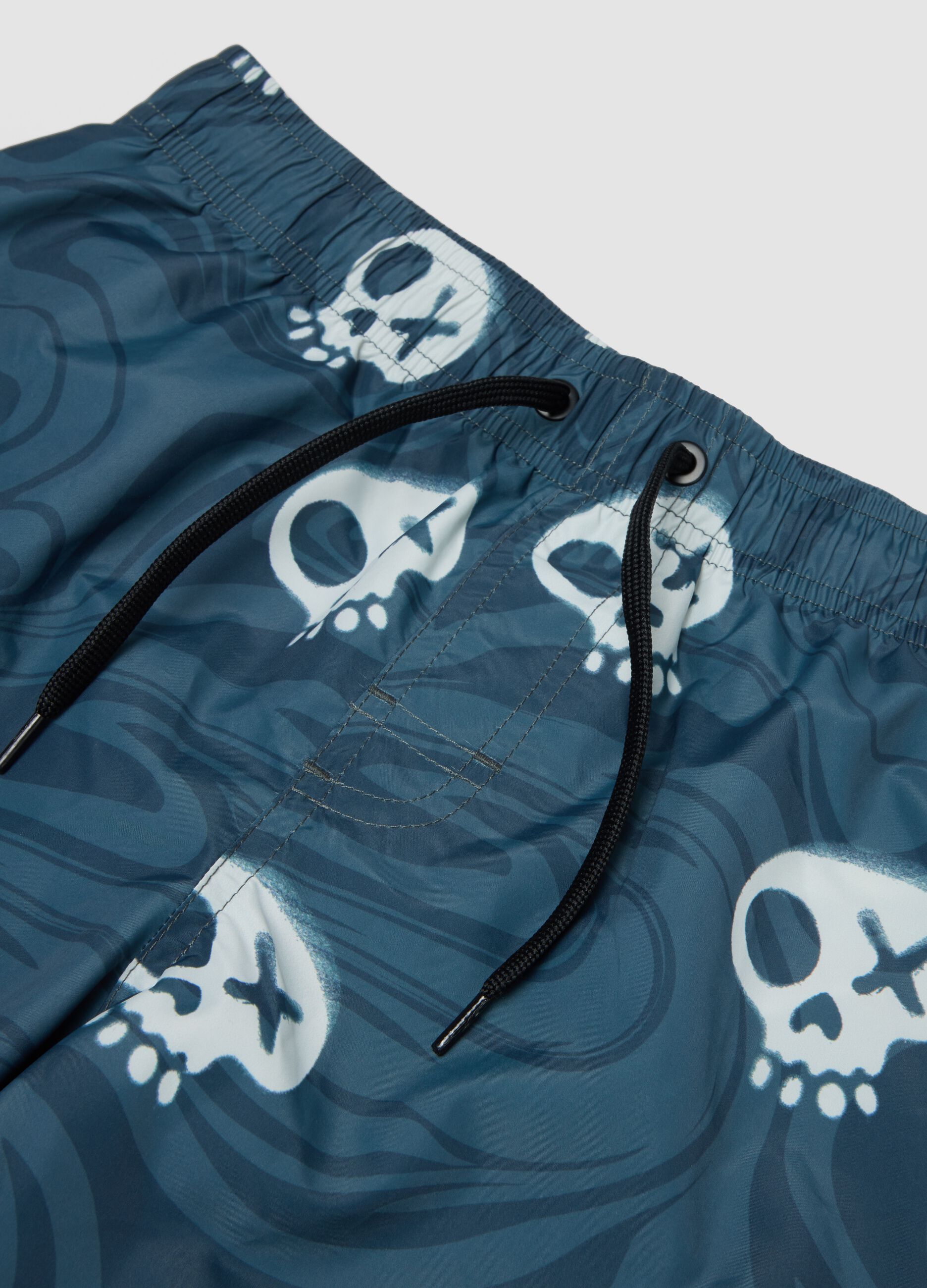 Blue skull-print swim shorts