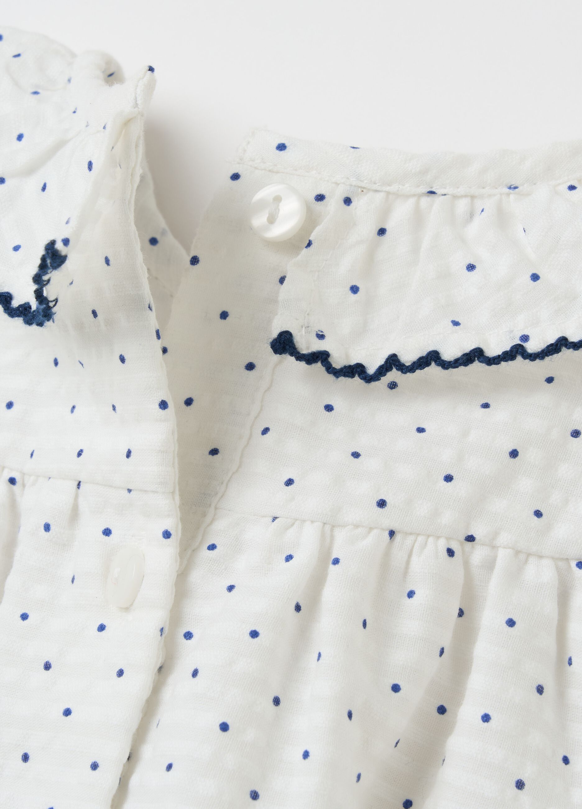 Romper suit with striped motif polka dot pattern