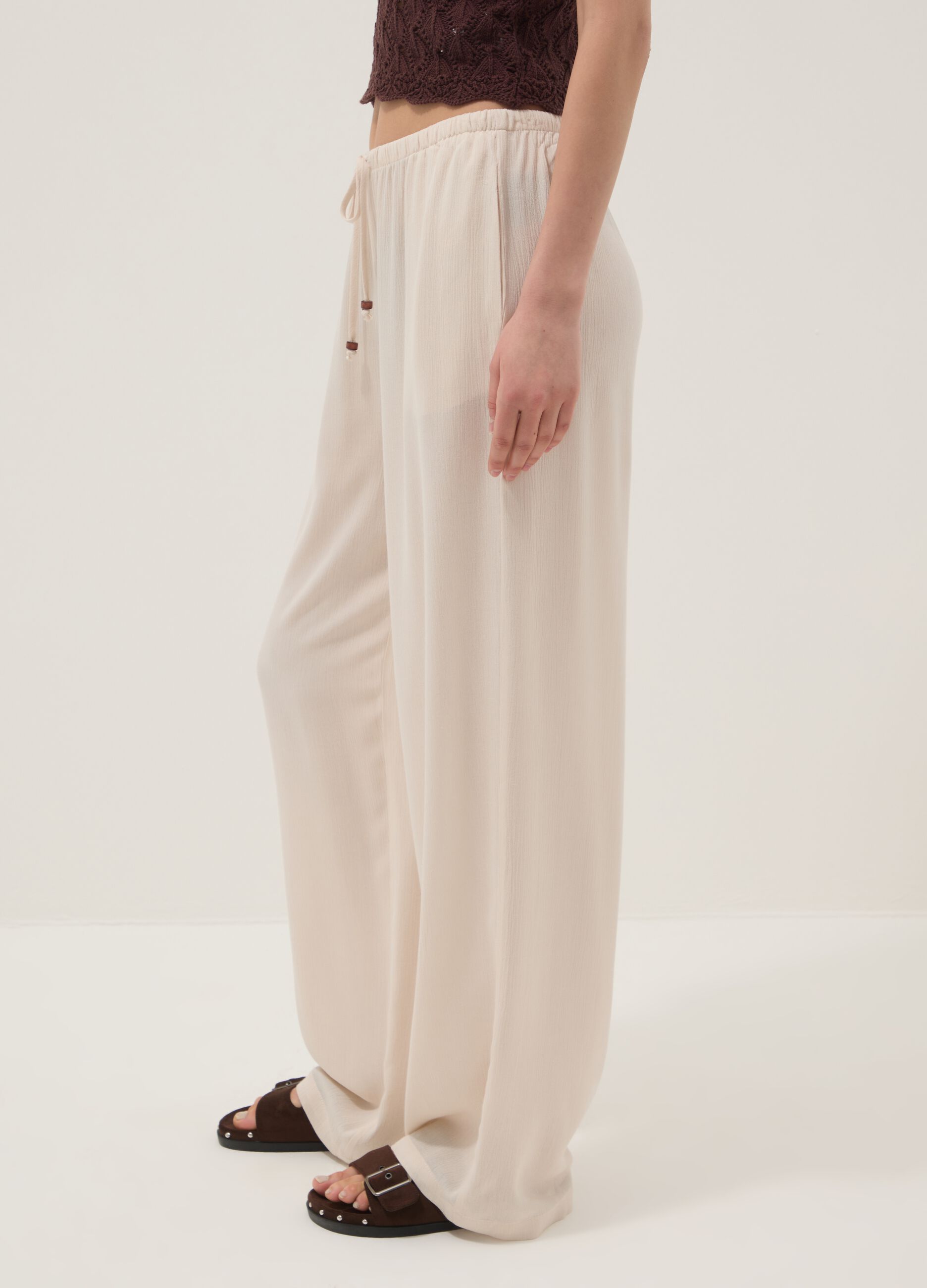 Beige palazzo trousers in pure viscose