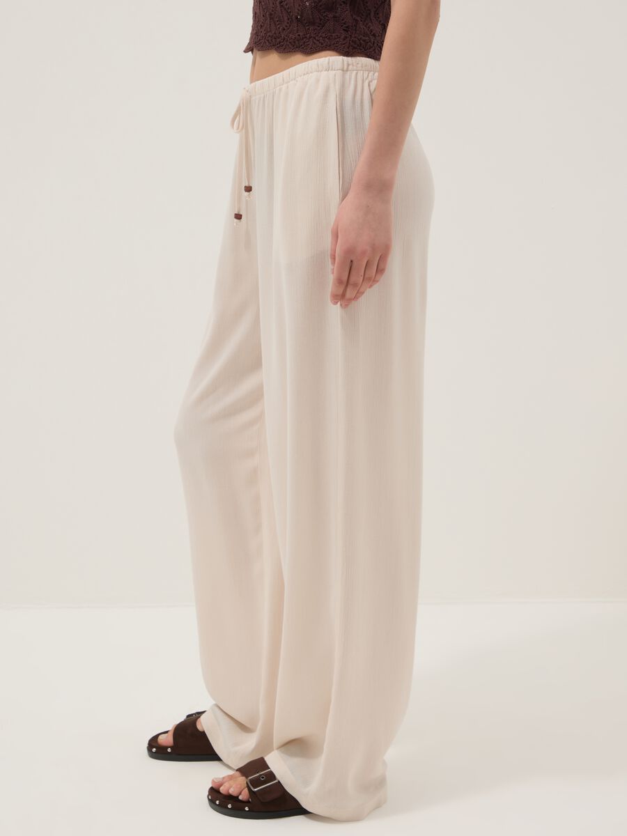 Beige palazzo trousers in pure viscose_3