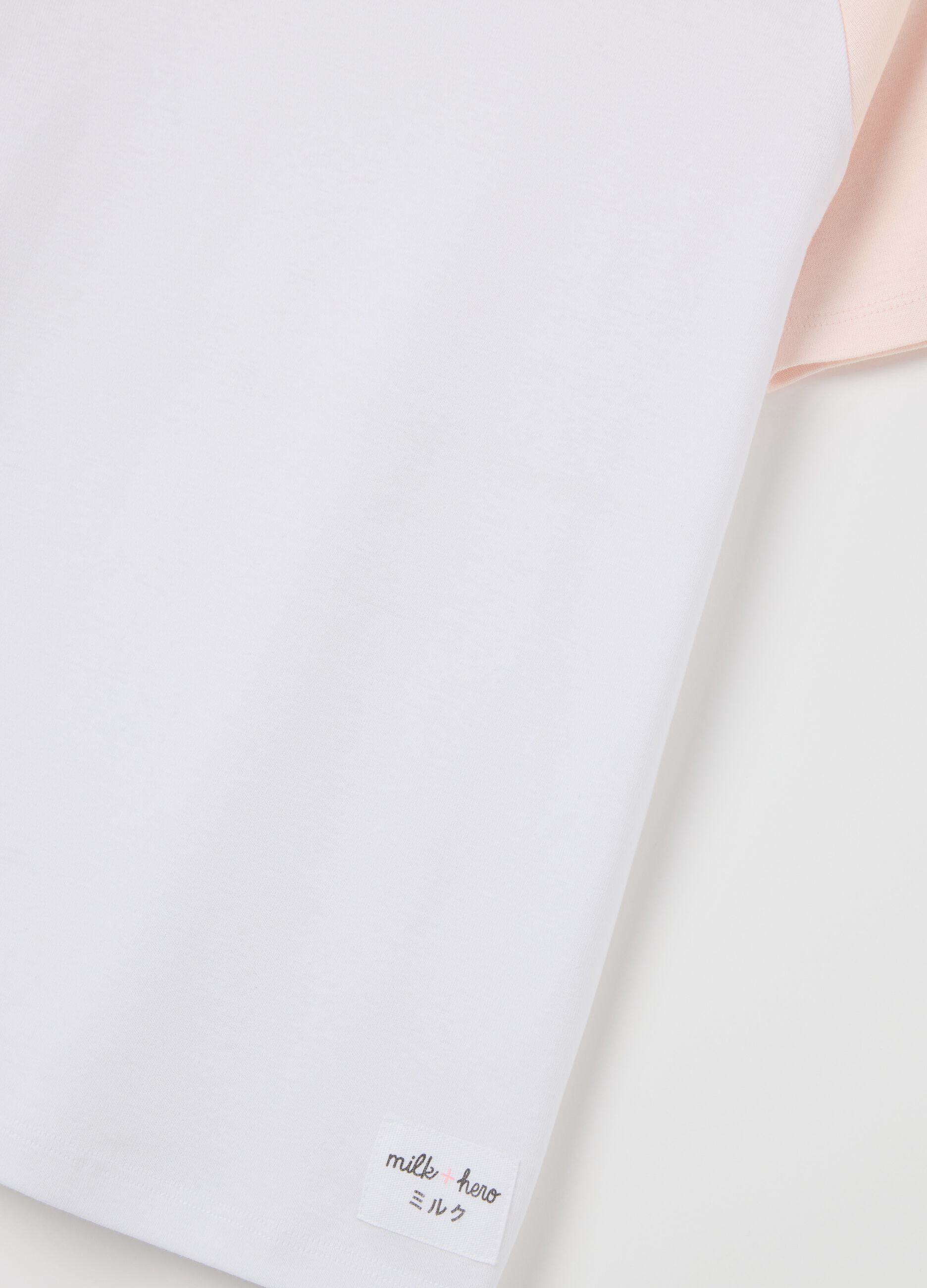 White T-shirt with pink raglan sleeves
