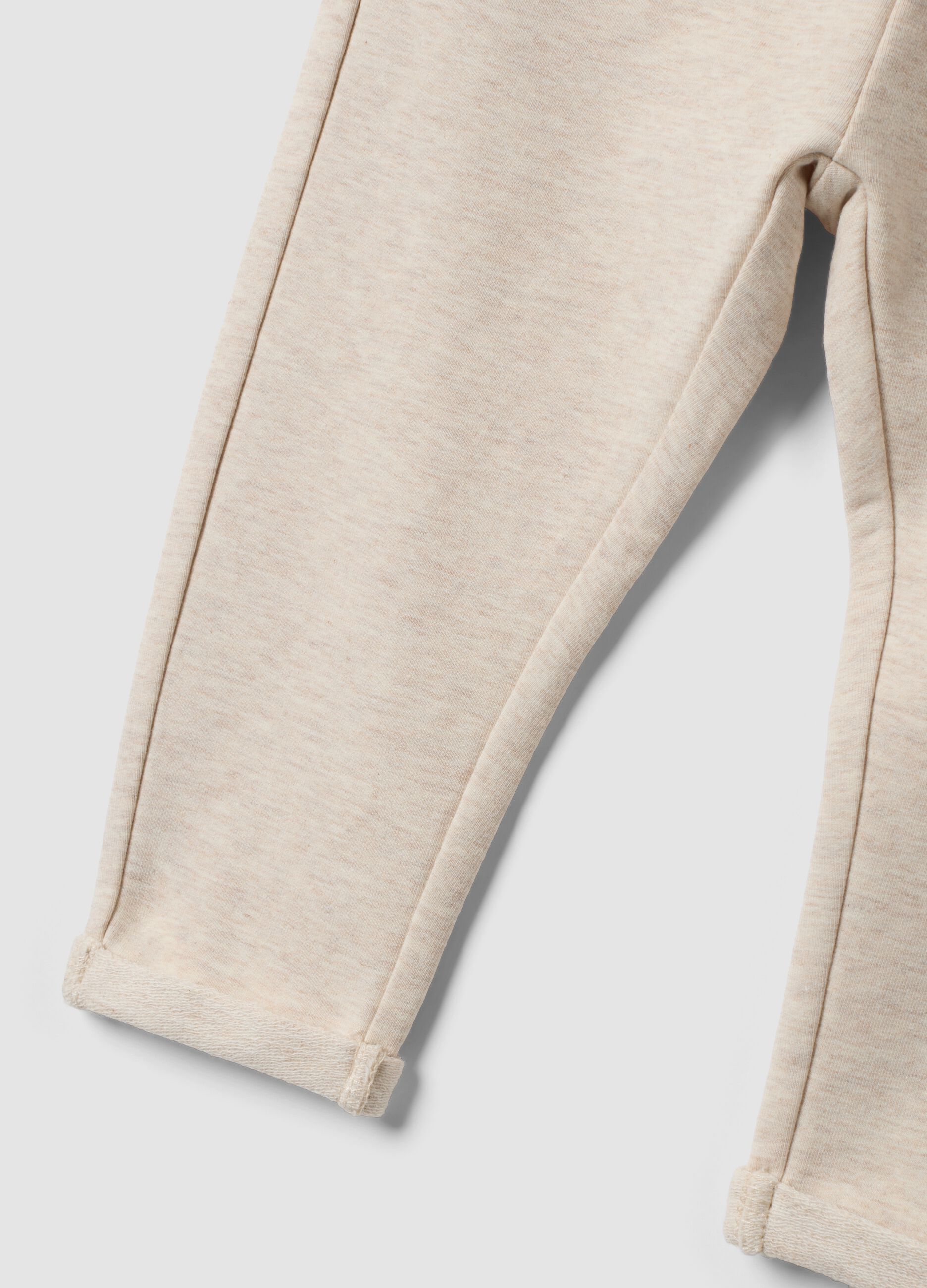 Beige stretch cotton joggers with turn-up cuff for baby girl