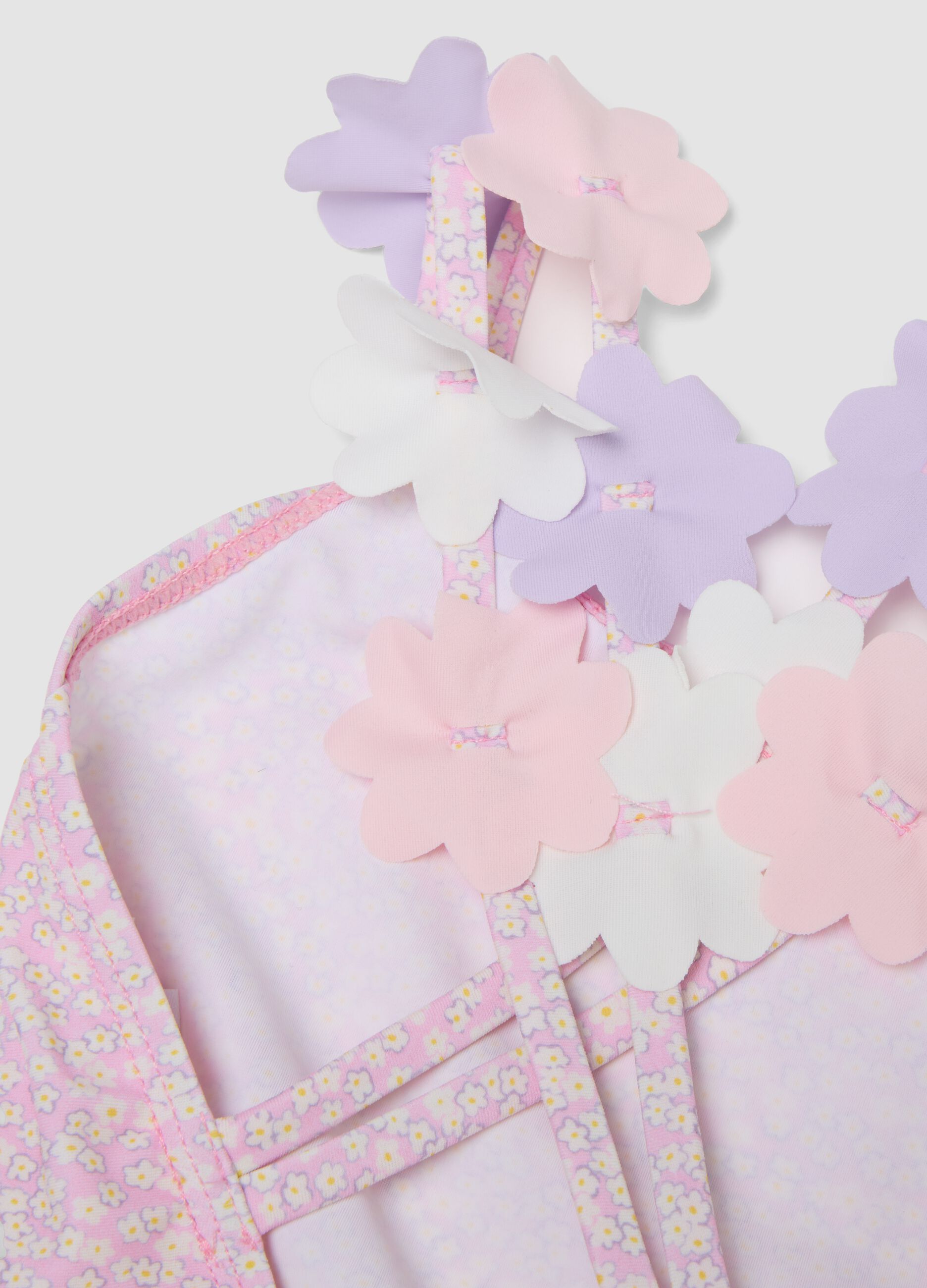 Pink stretch swimsuit with appliqu&eacute; flowers