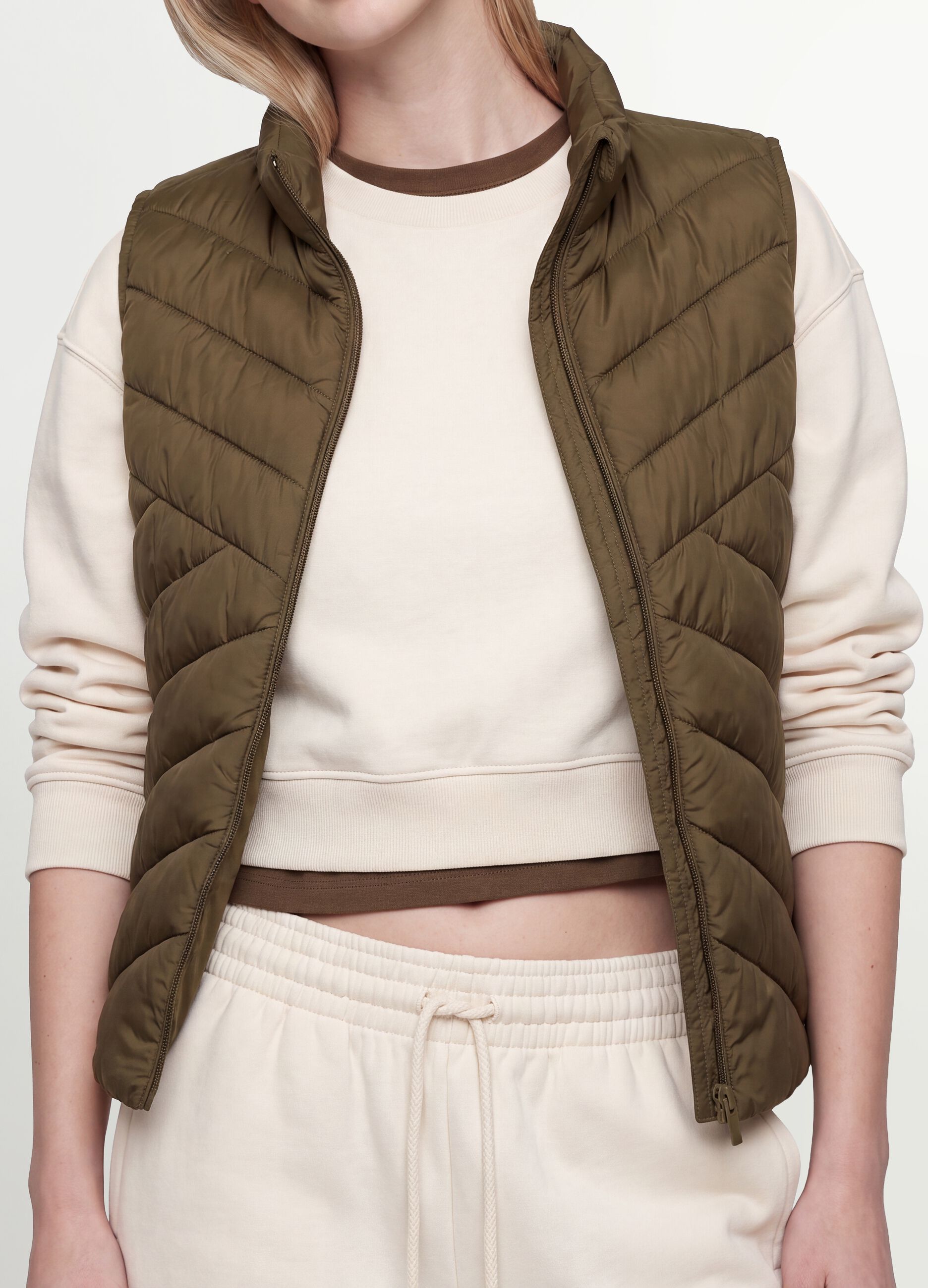 Green ultralight quilted gilet with zip and high neck