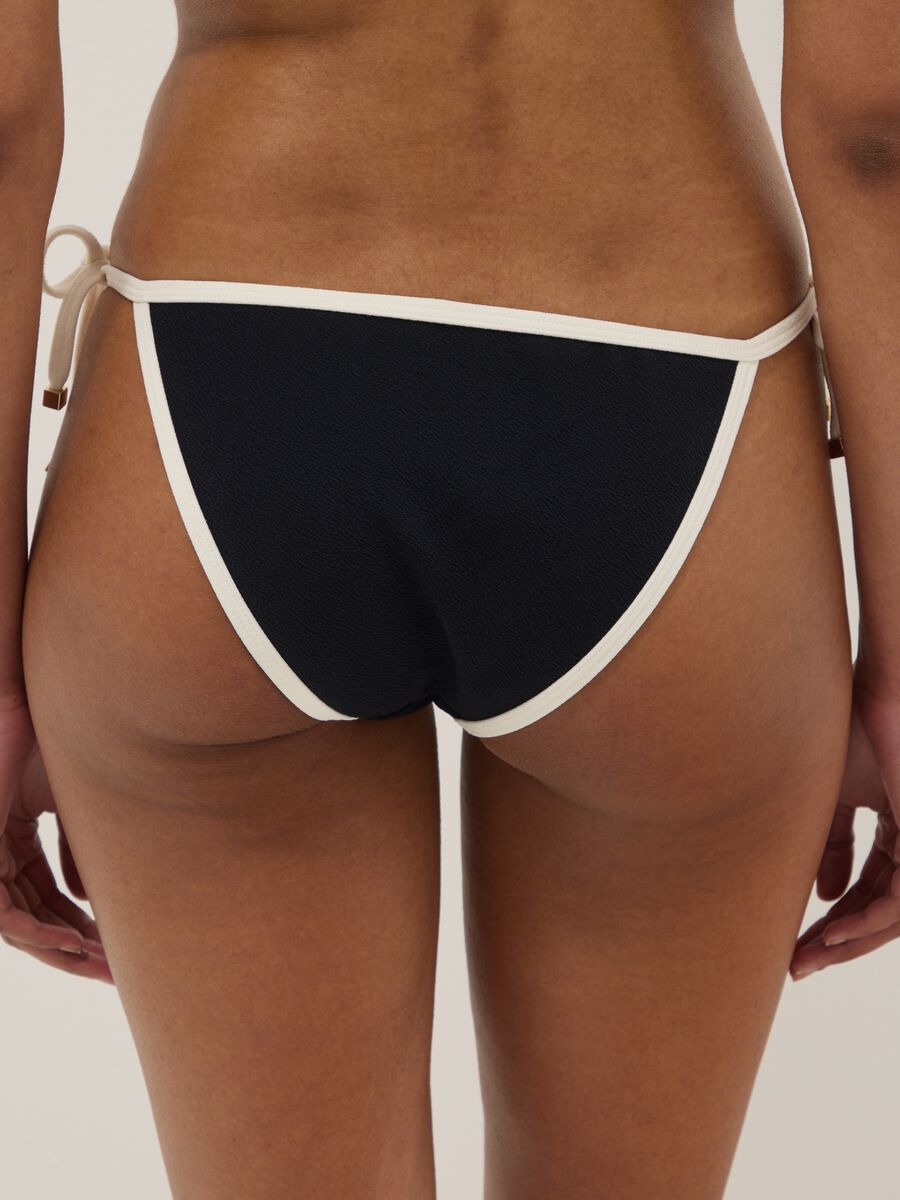 Black and white bikini bottoms in stretch fabric with side ties_2