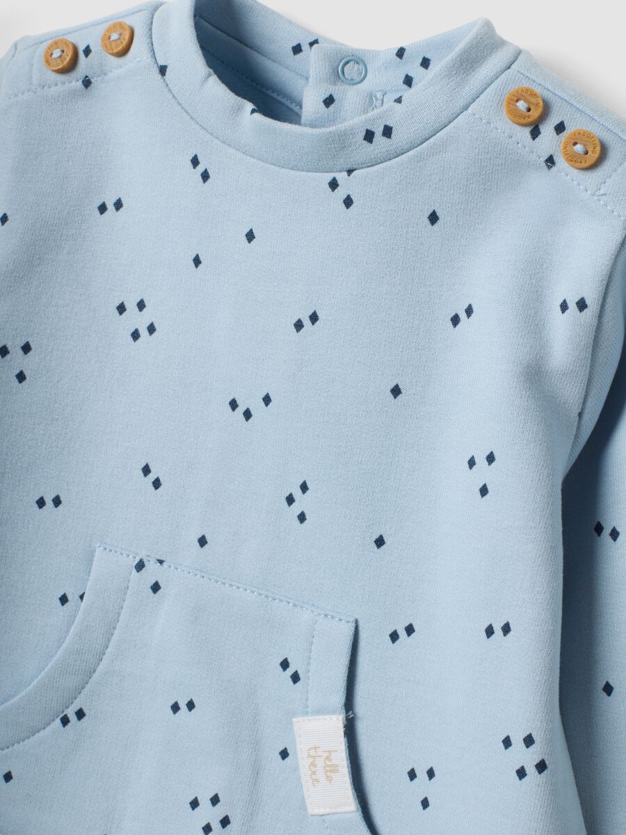 Tutina azzurra in puro cotone organico con stampa all over_3