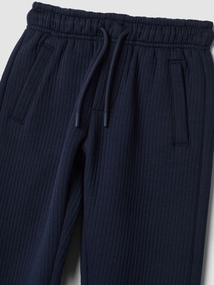 Blue ribbed cotton-blend trousers_1