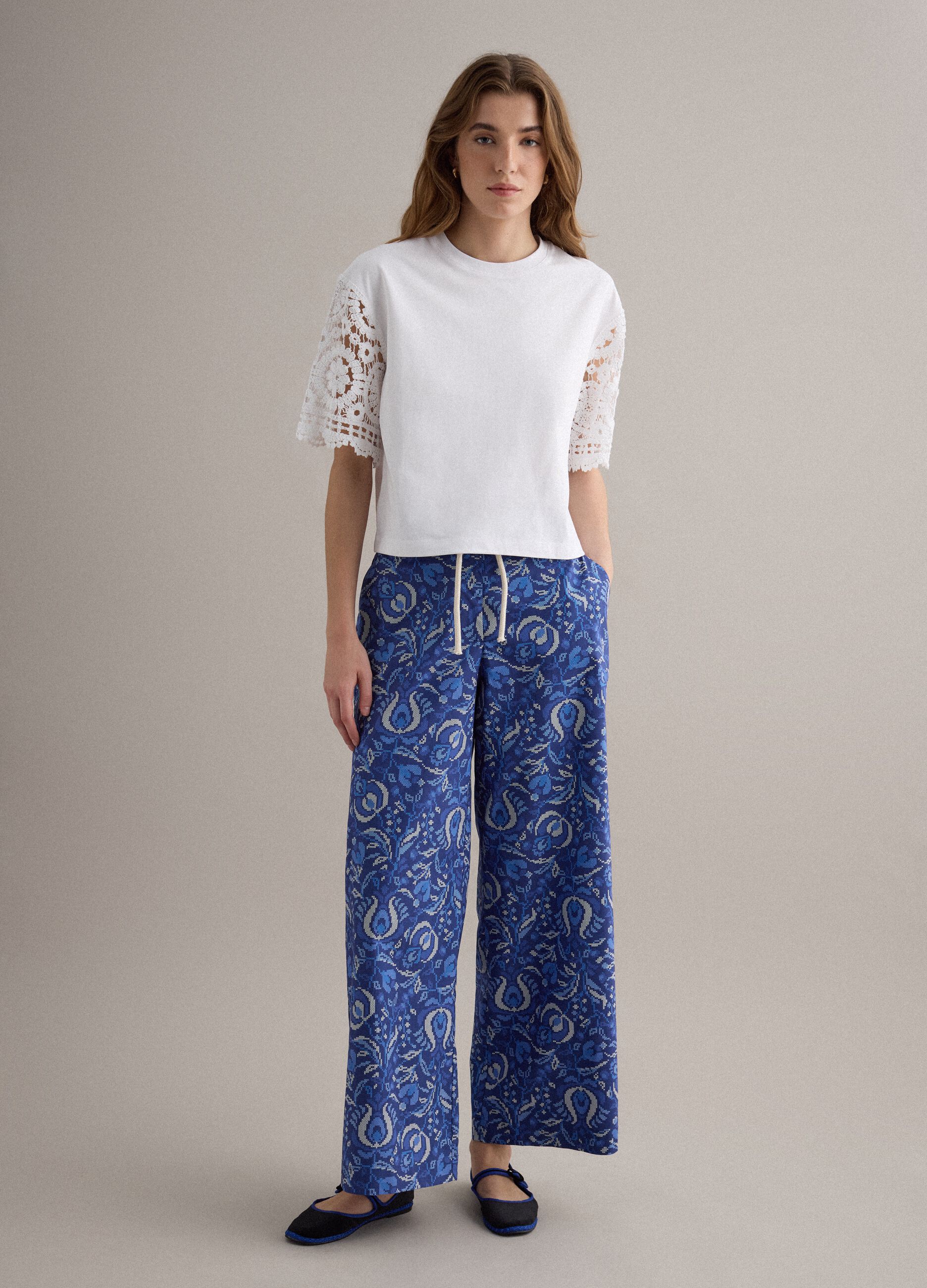 White short-sleeve cotton-blend T-shirt with mesh details