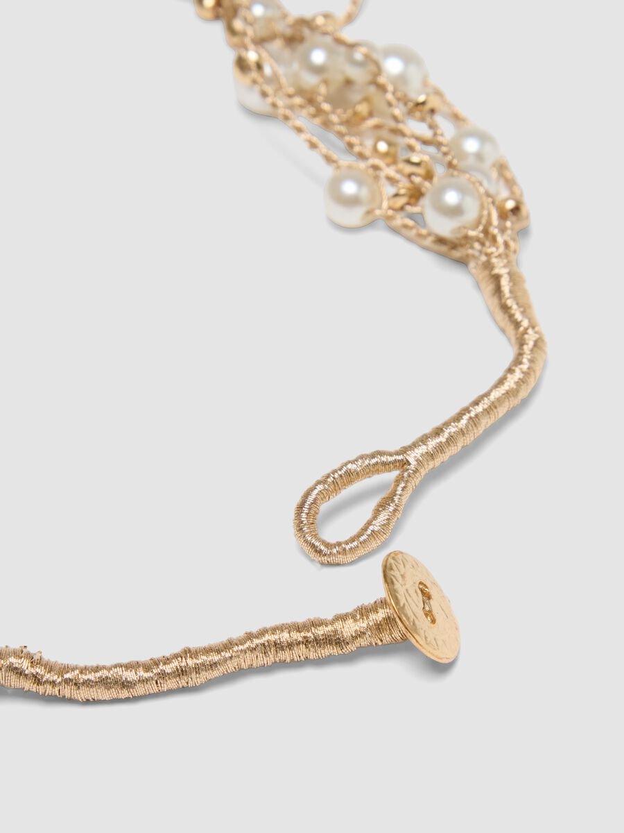 Collana beige con perle e fili intrecciati_2