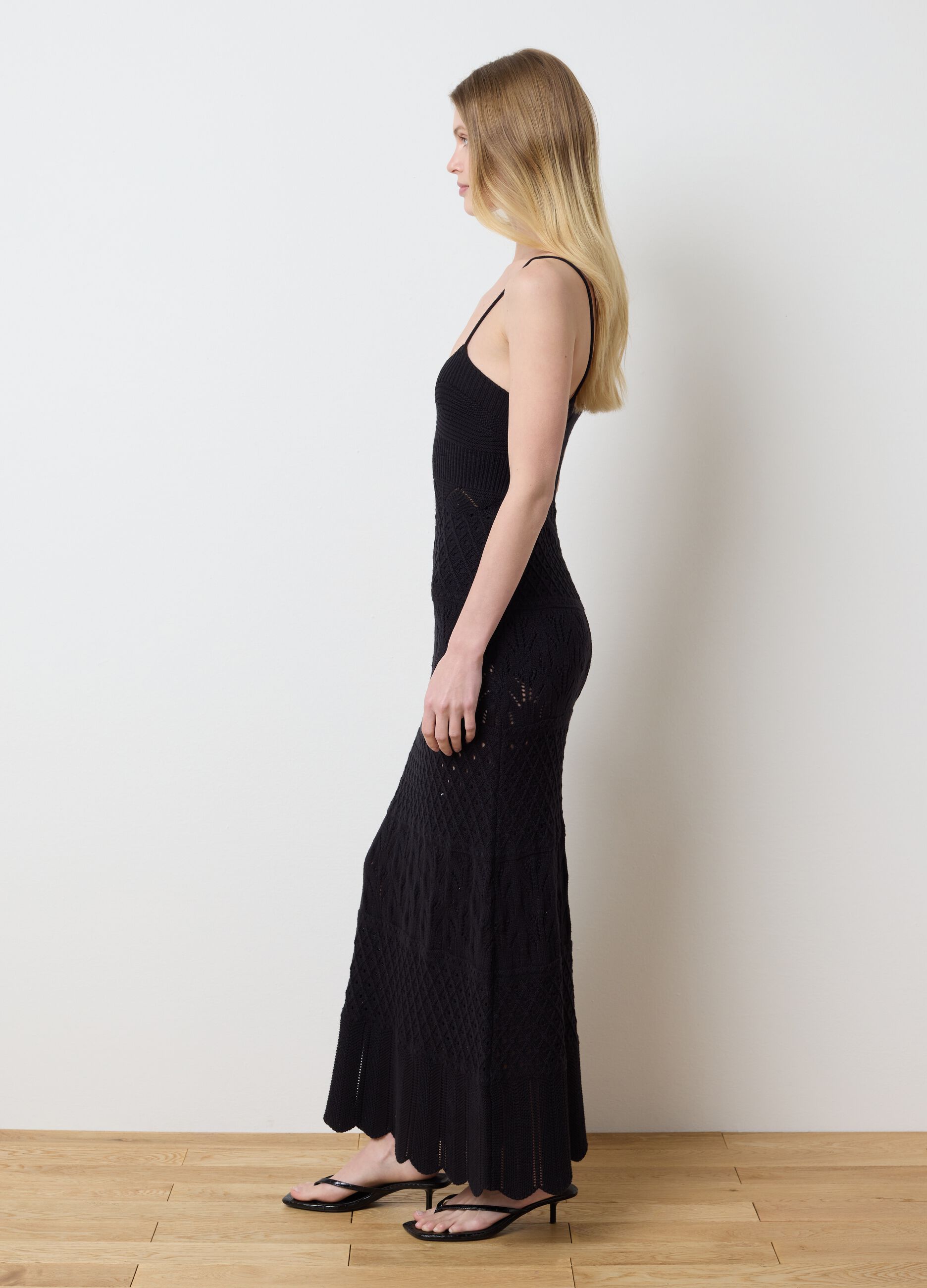 Long black dress in crochet knit