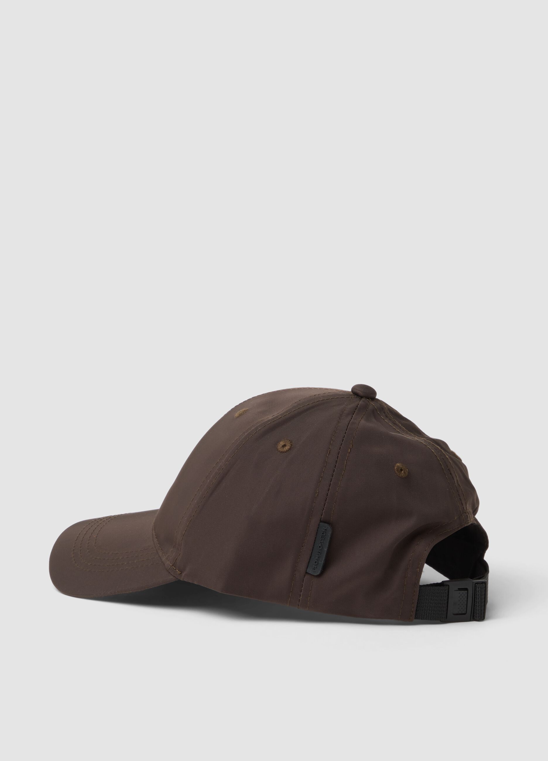 Brown cap with curved peak