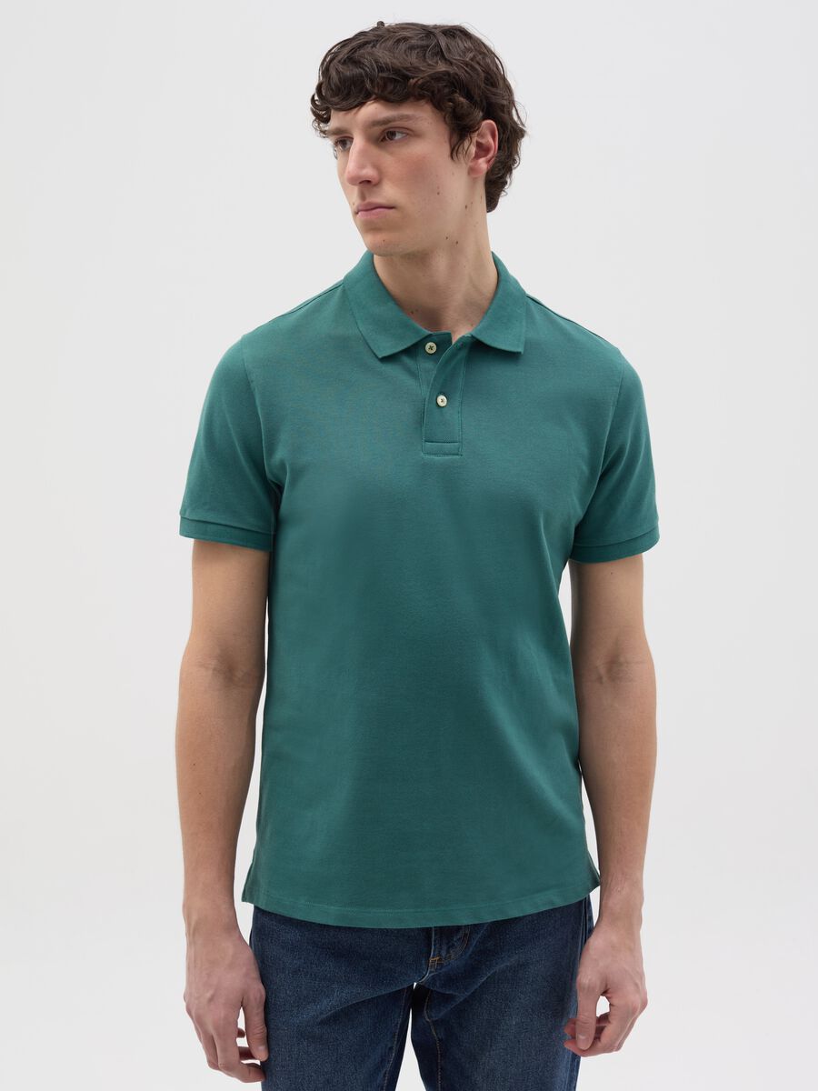 Solid colour polo shirt in organic cotton_0