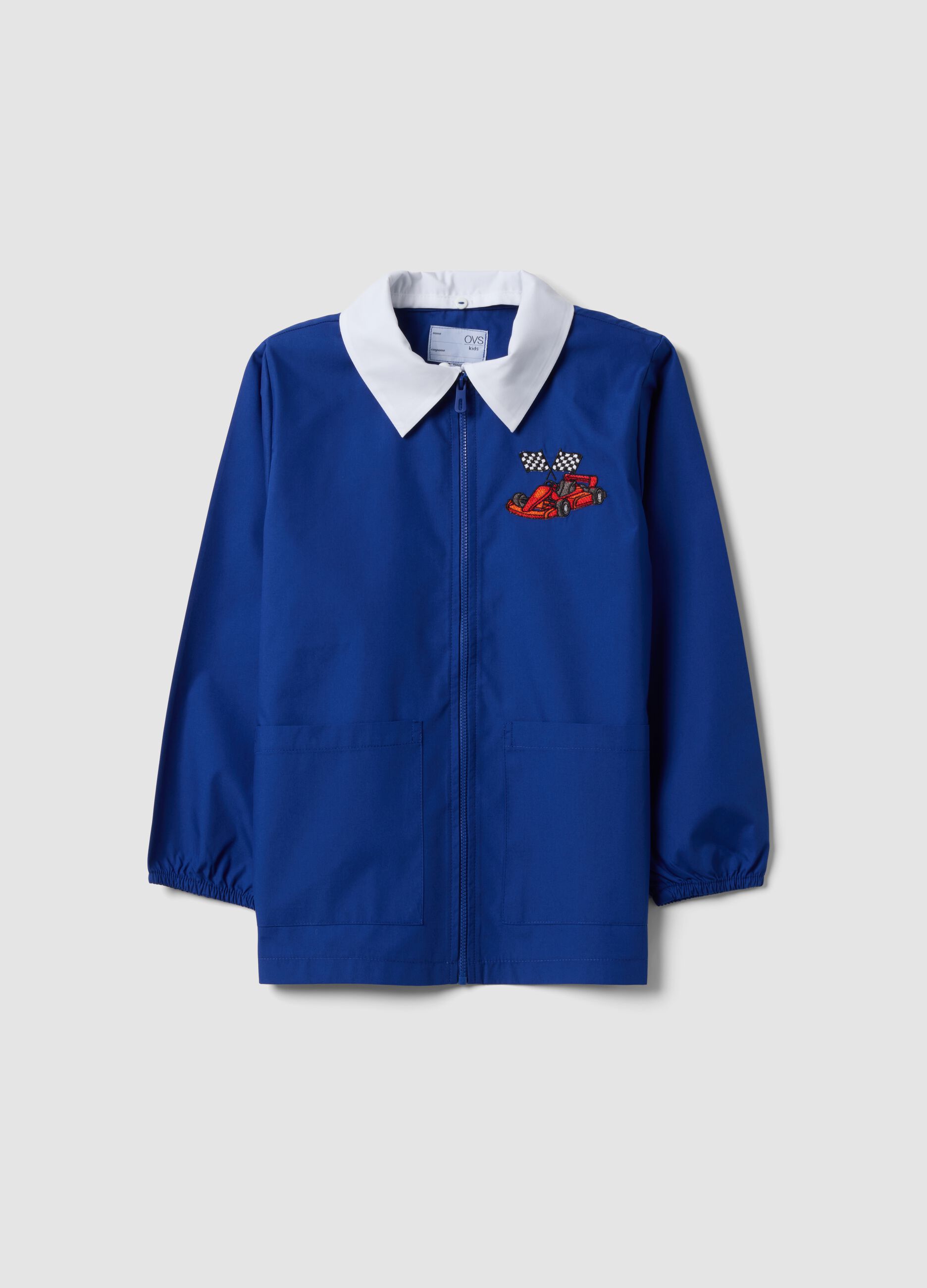Blue boys&rsquo; school apron with zip and go-kart embroidery