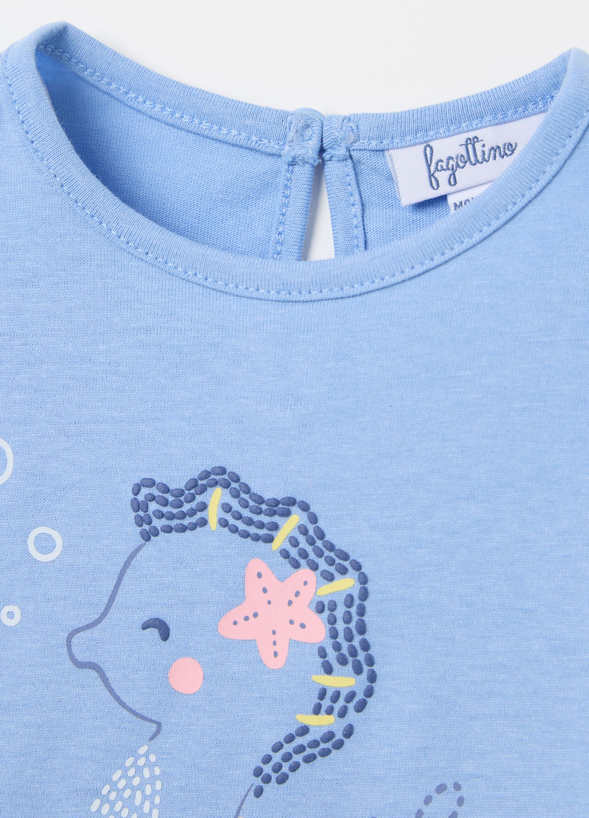 Light blue T-shirt in cotton with print and flounce