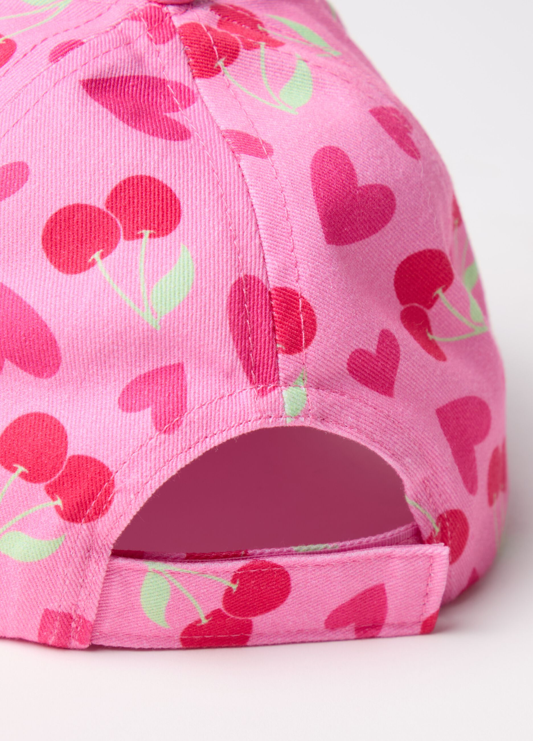 Baseball cap with cherries and hearts print