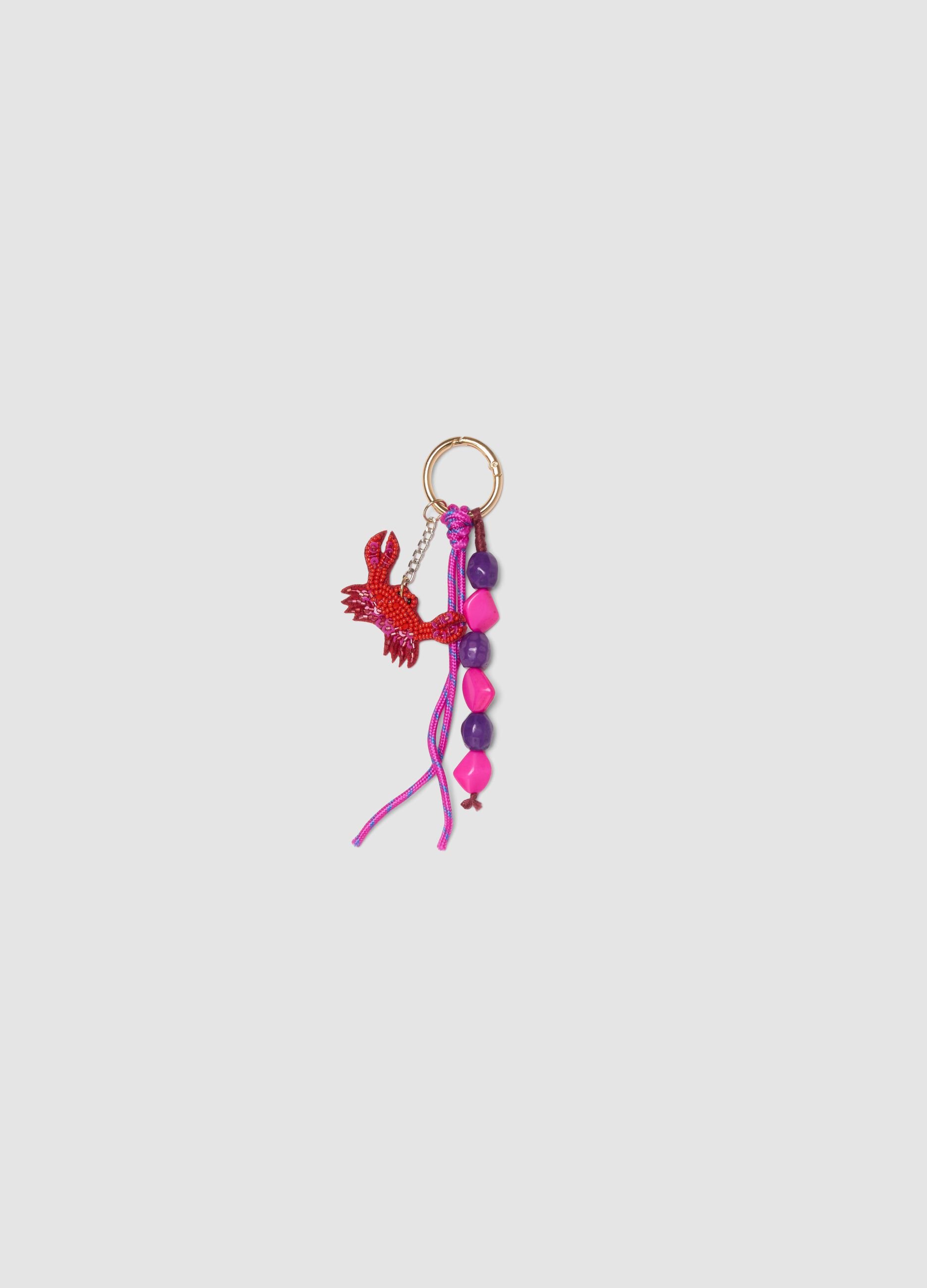 Red keyring with decorative crab and beads