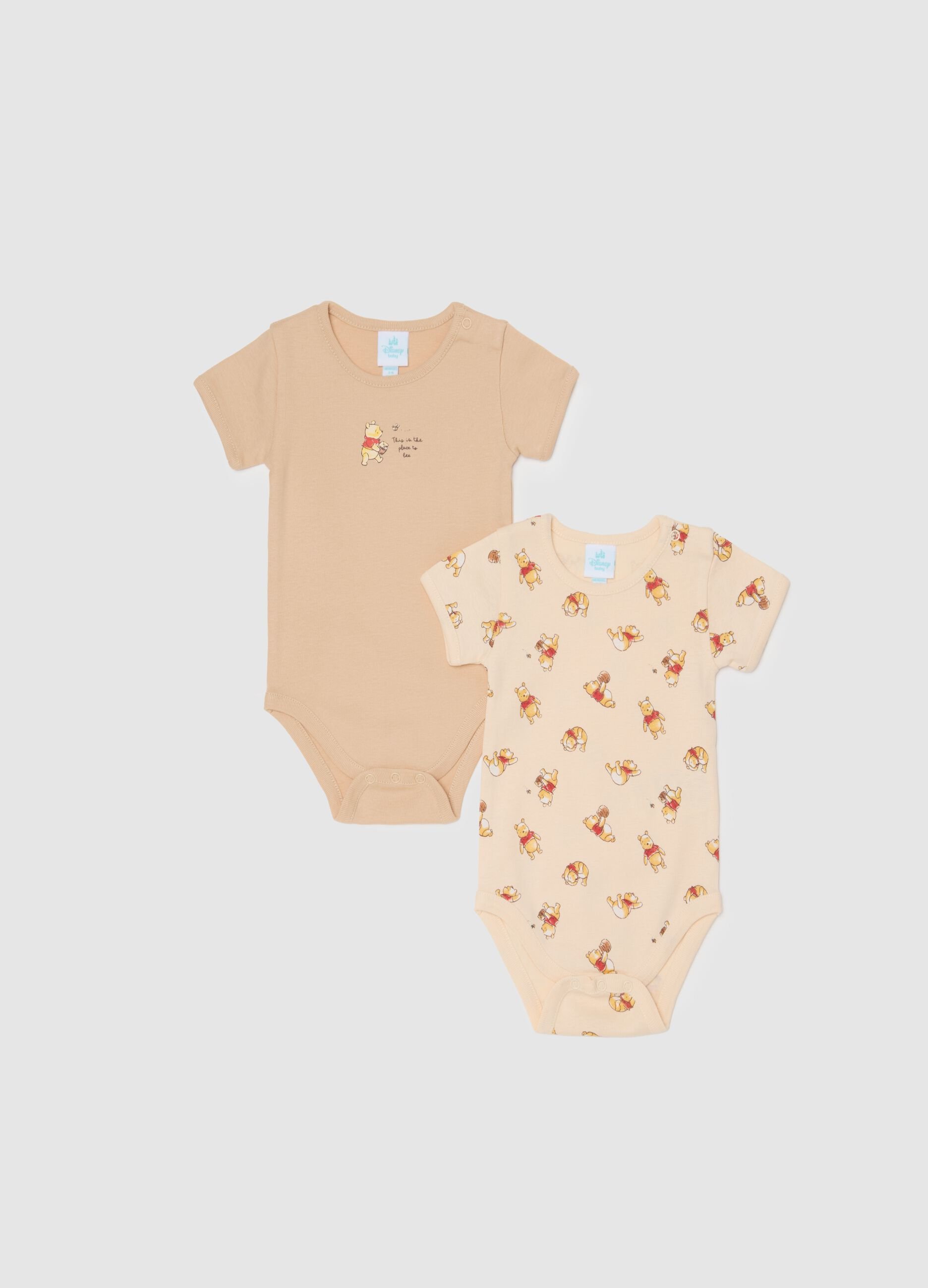 Unisex baby bodysuit in pure beige cotton with Winnie the Pooh print