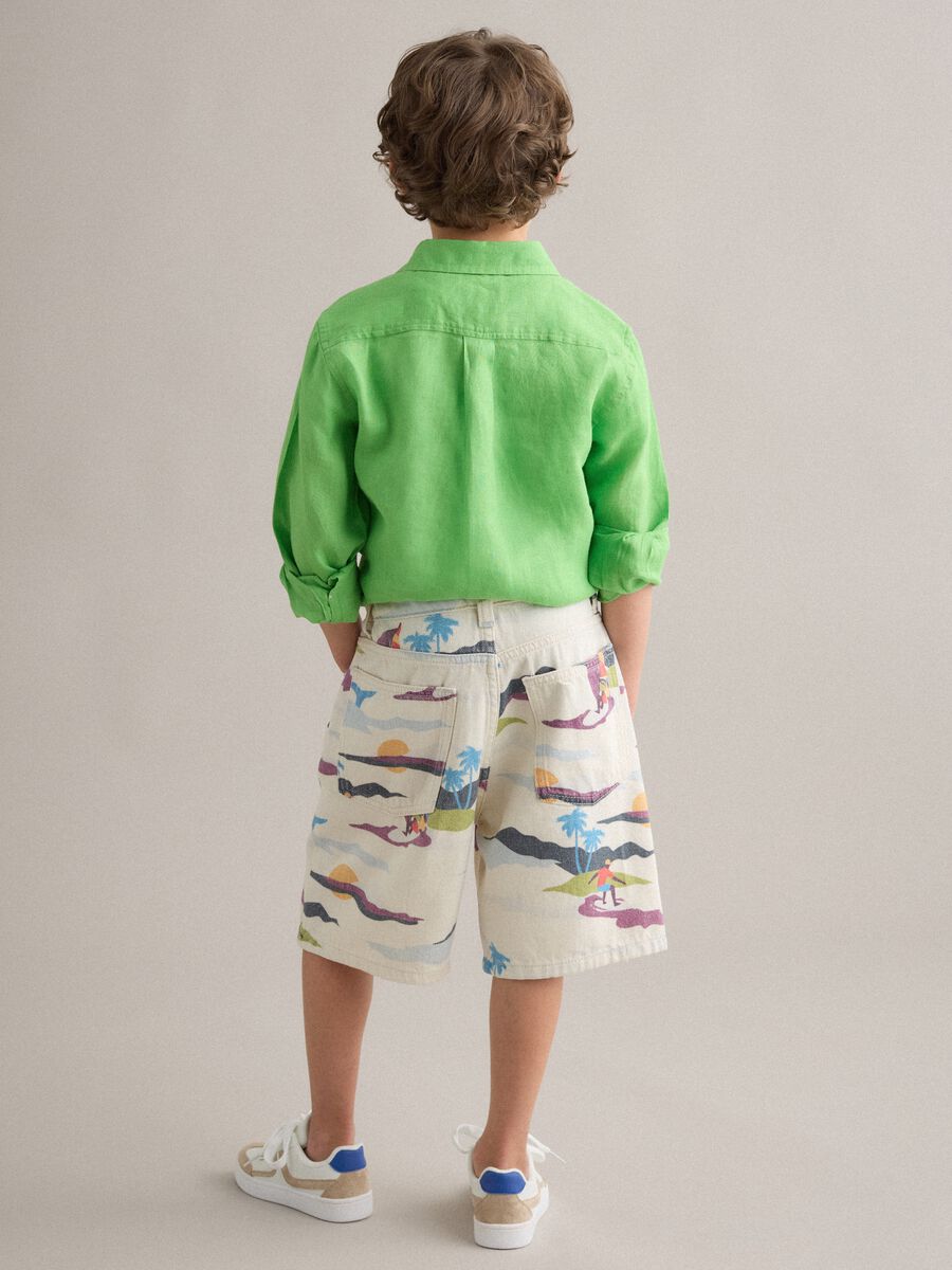 Shorts beige in puro cotone con stampa all over baggy fit_1