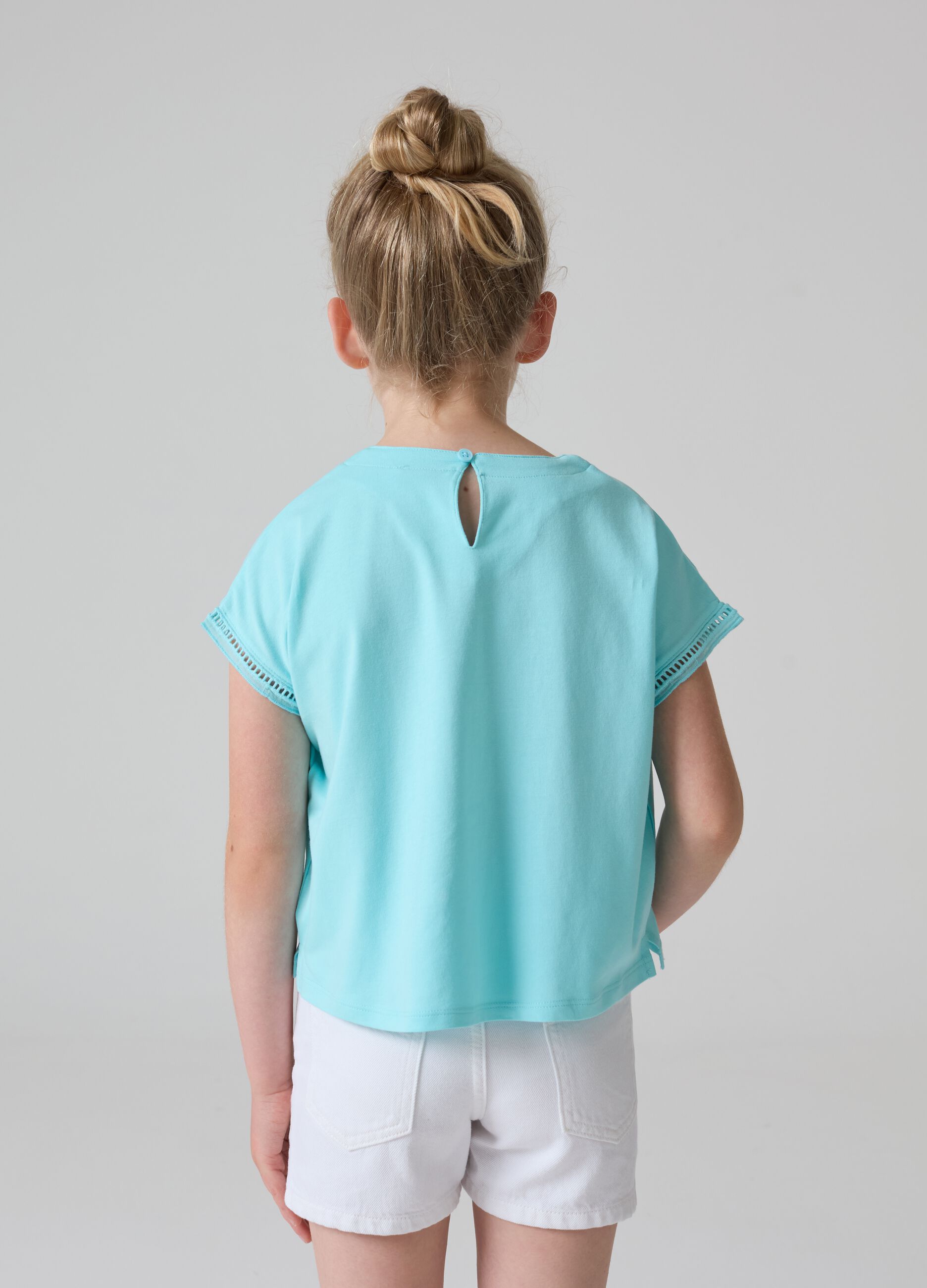T-shirt tinta unita con inserti traforati