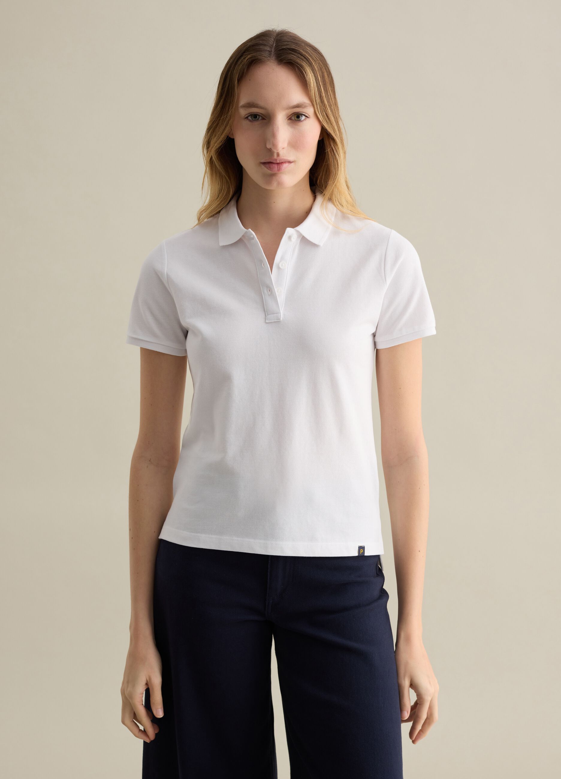 White short-sleeved polo shirt in piquet