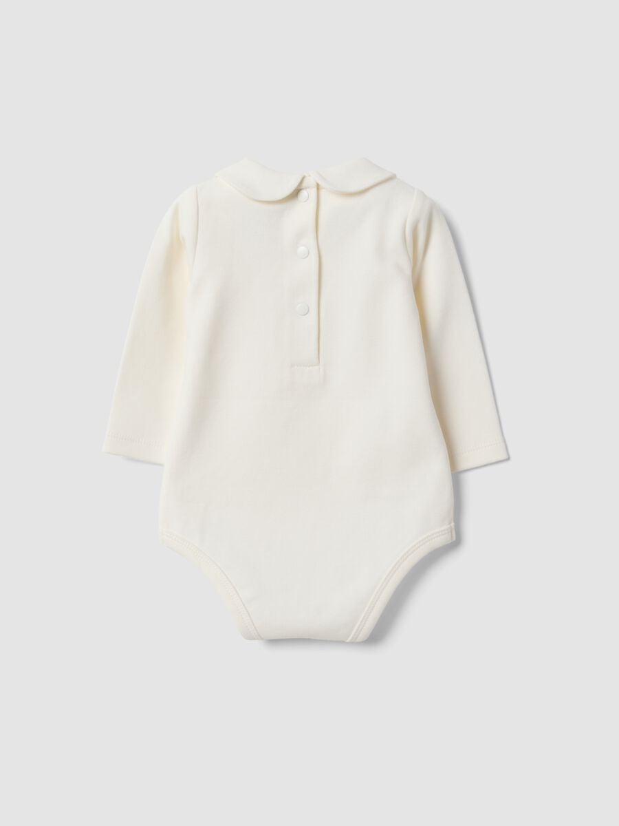 Body bianco in puro cotone organico con ricami floreali per neonata_1