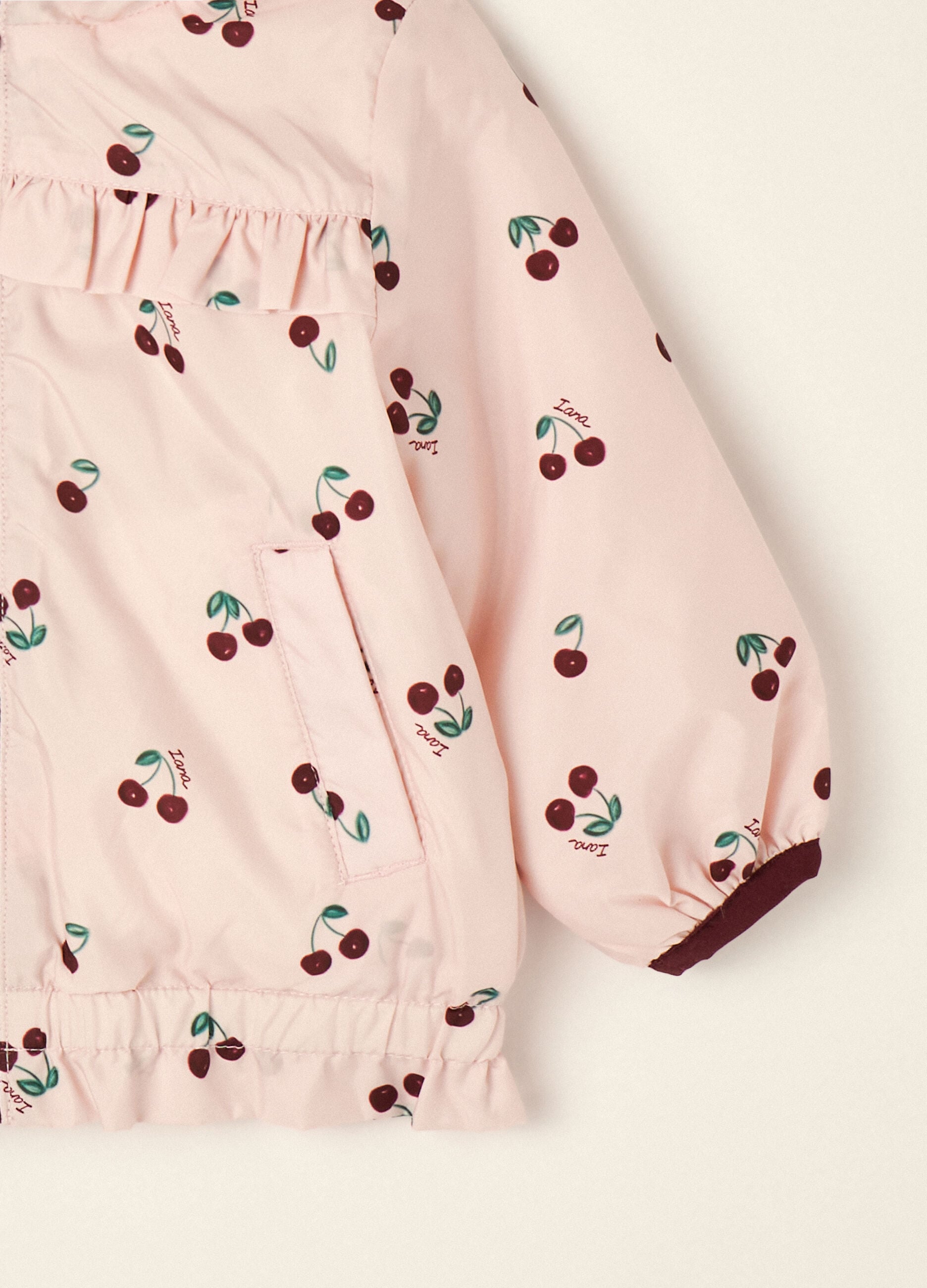 Pink padded hooded jacket with cherry print