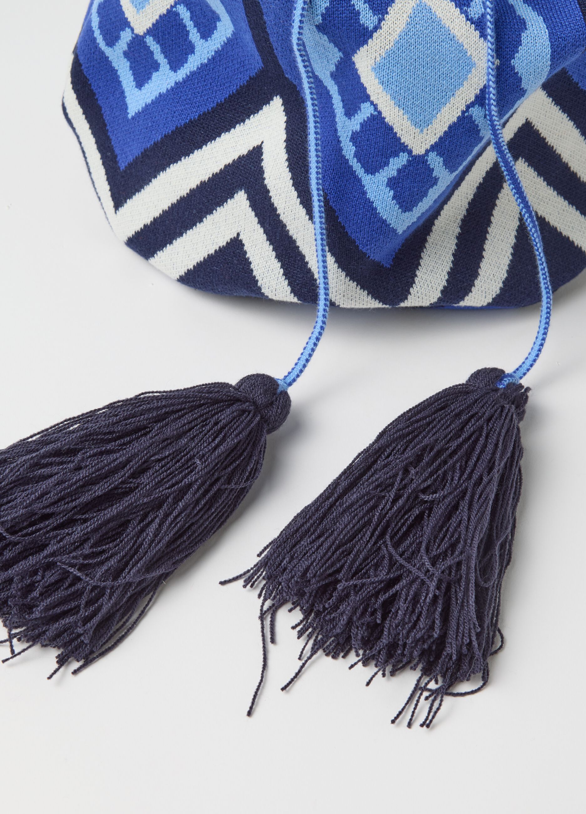 Shoulder bag with geometric motif and tassels