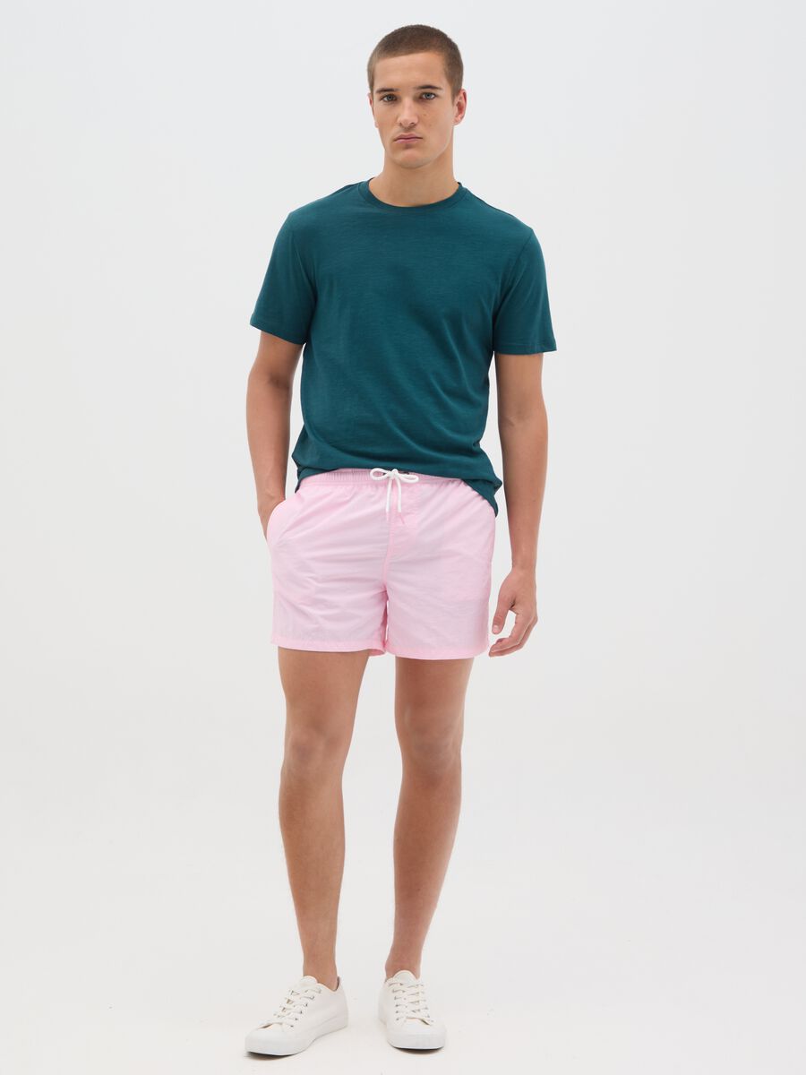 Pink swim trunks in mixed materials_0