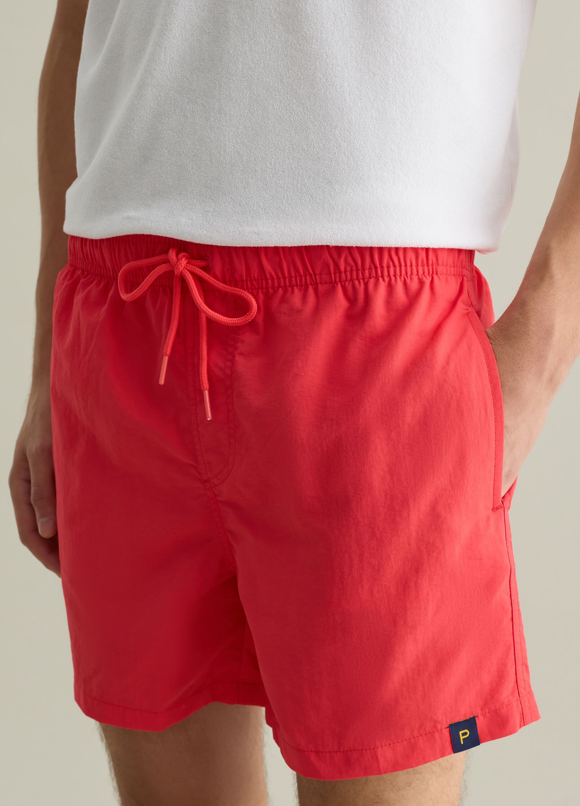 Men’s regular-fit swim boxers in red blend with elastic waist