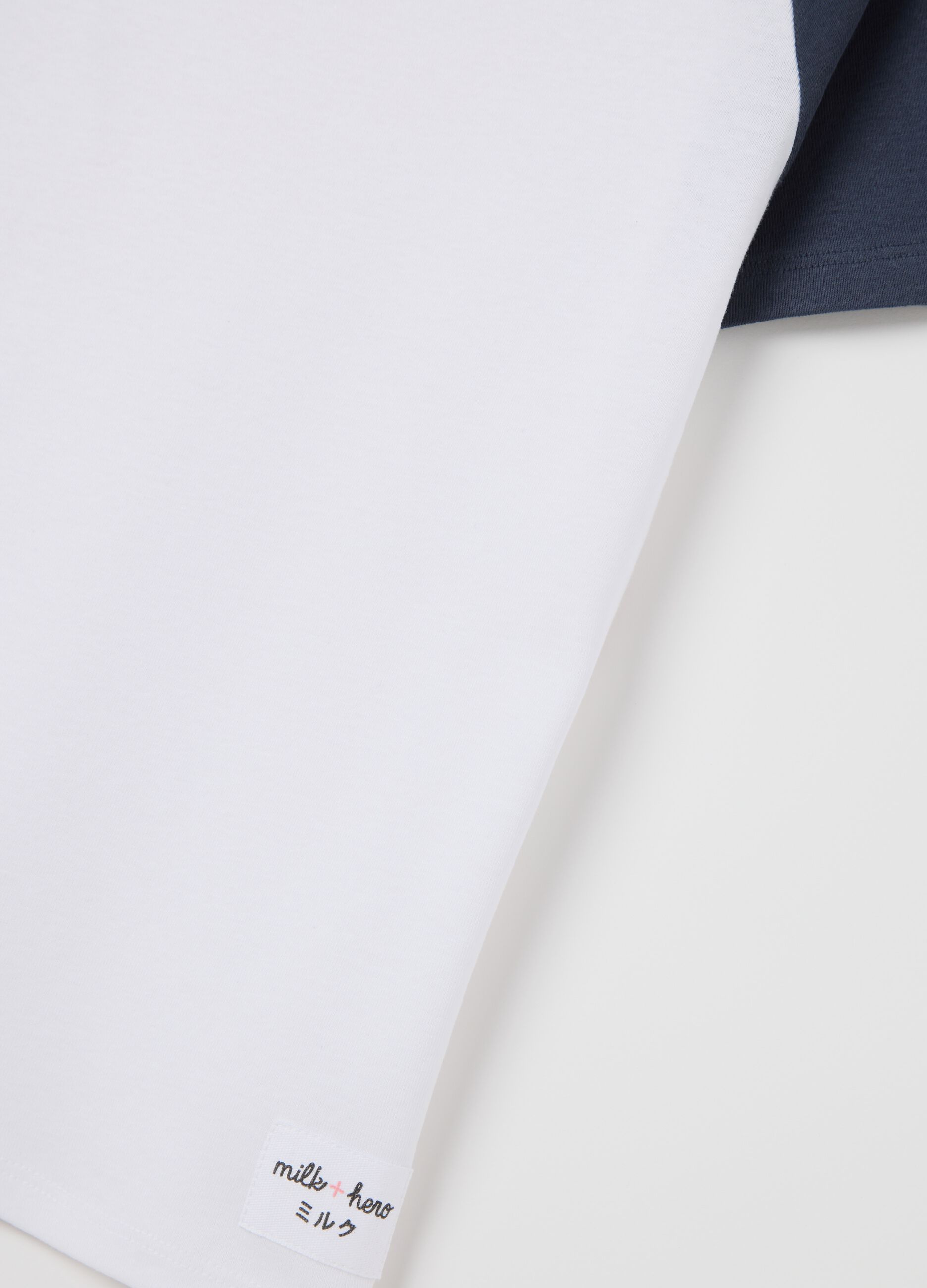 White T-shirt with blue raglan sleeves