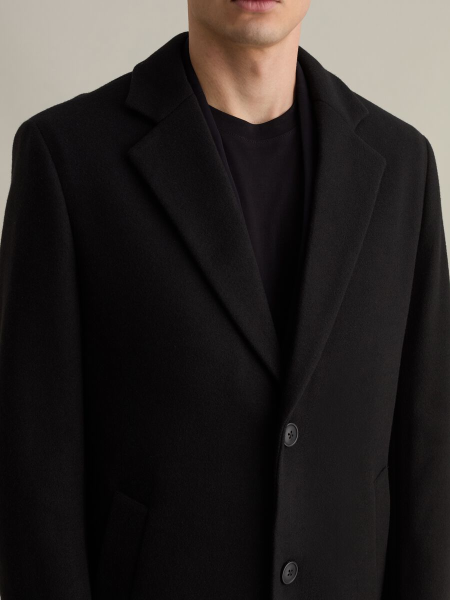 Long single-breasted solid colour coat_5