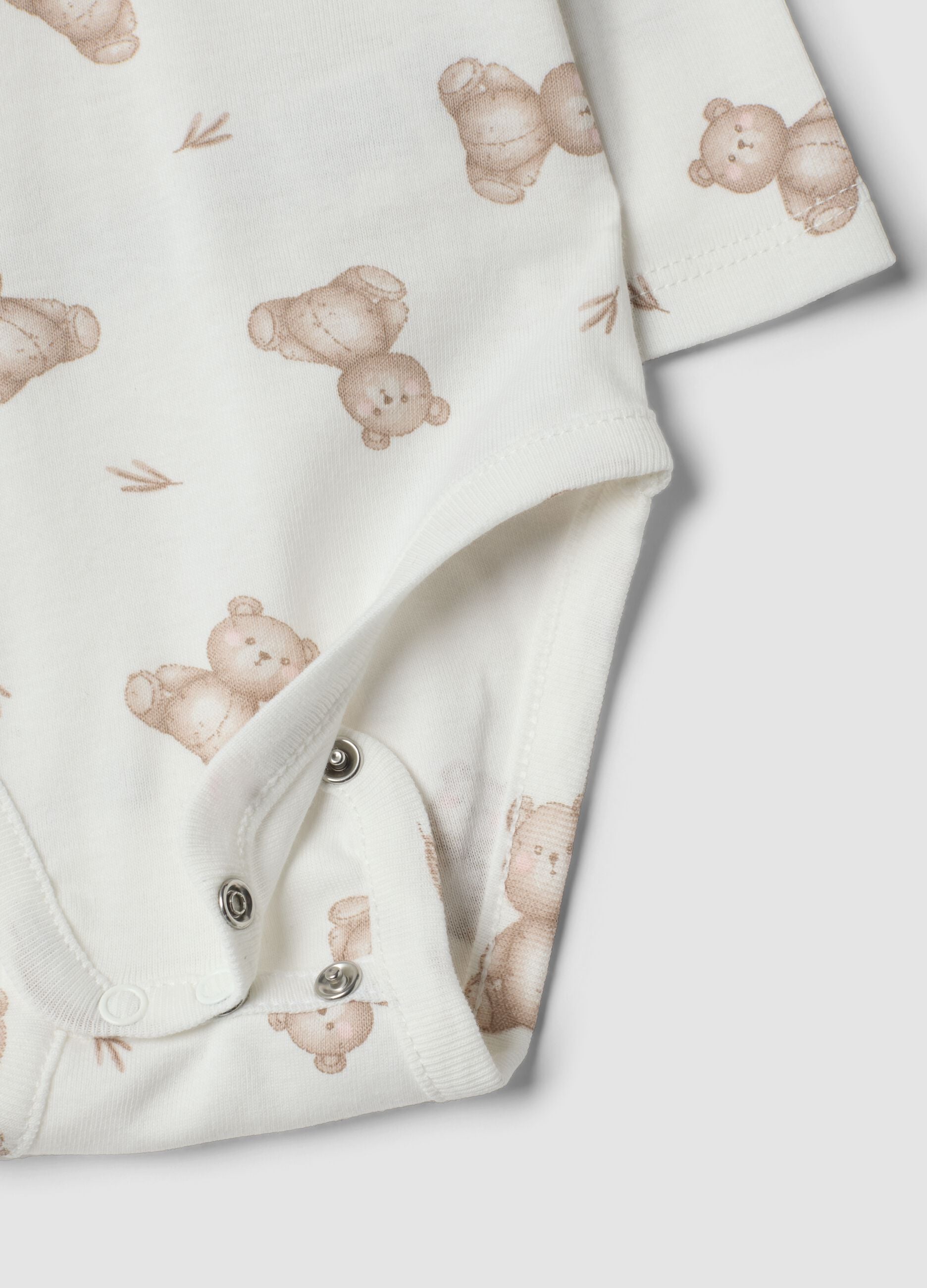 Set bianco in puro cotone organico con body e leggings stampati per neonati